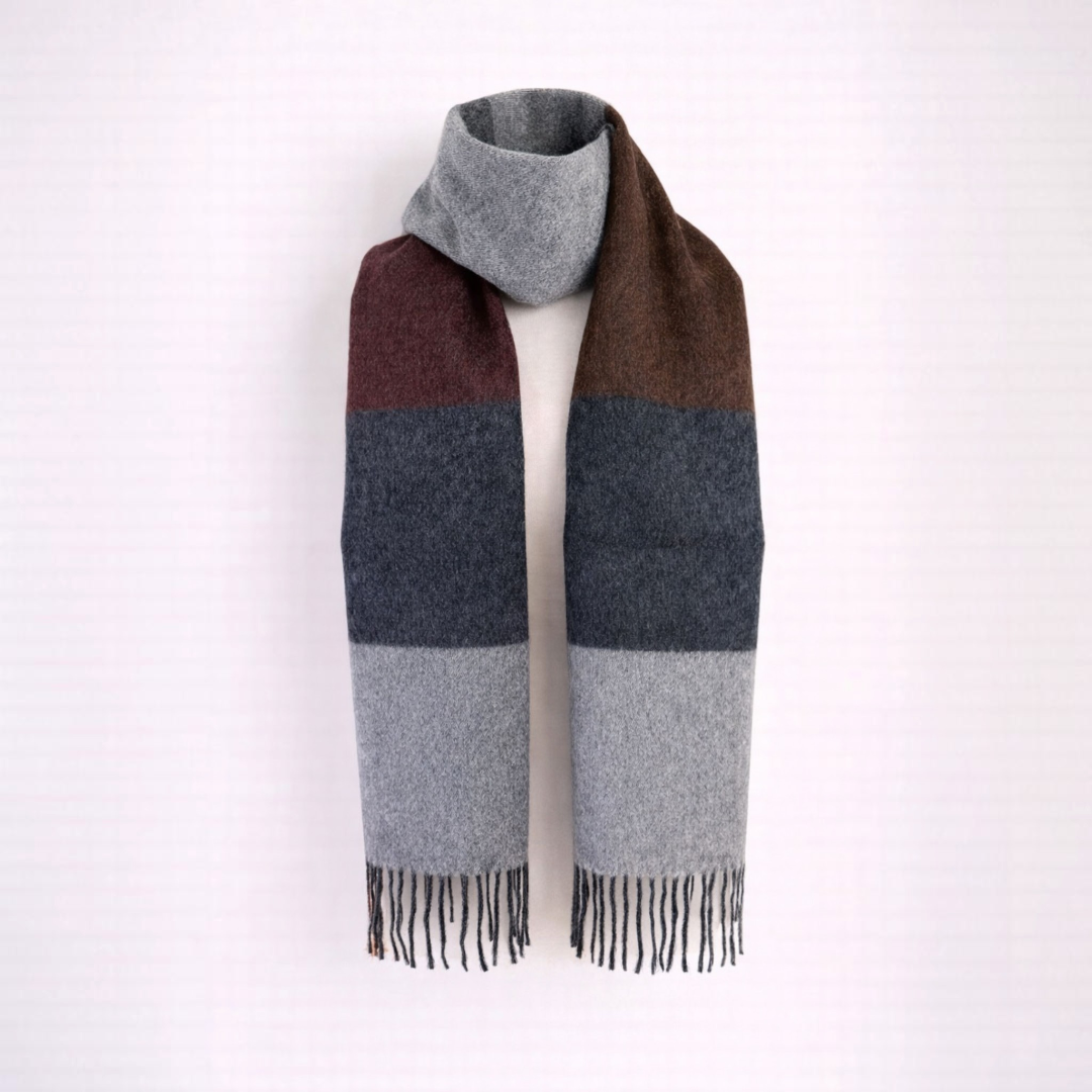 Luxury alpaca scarf with neutral stripe pattern, elegant cold weather accessory.
