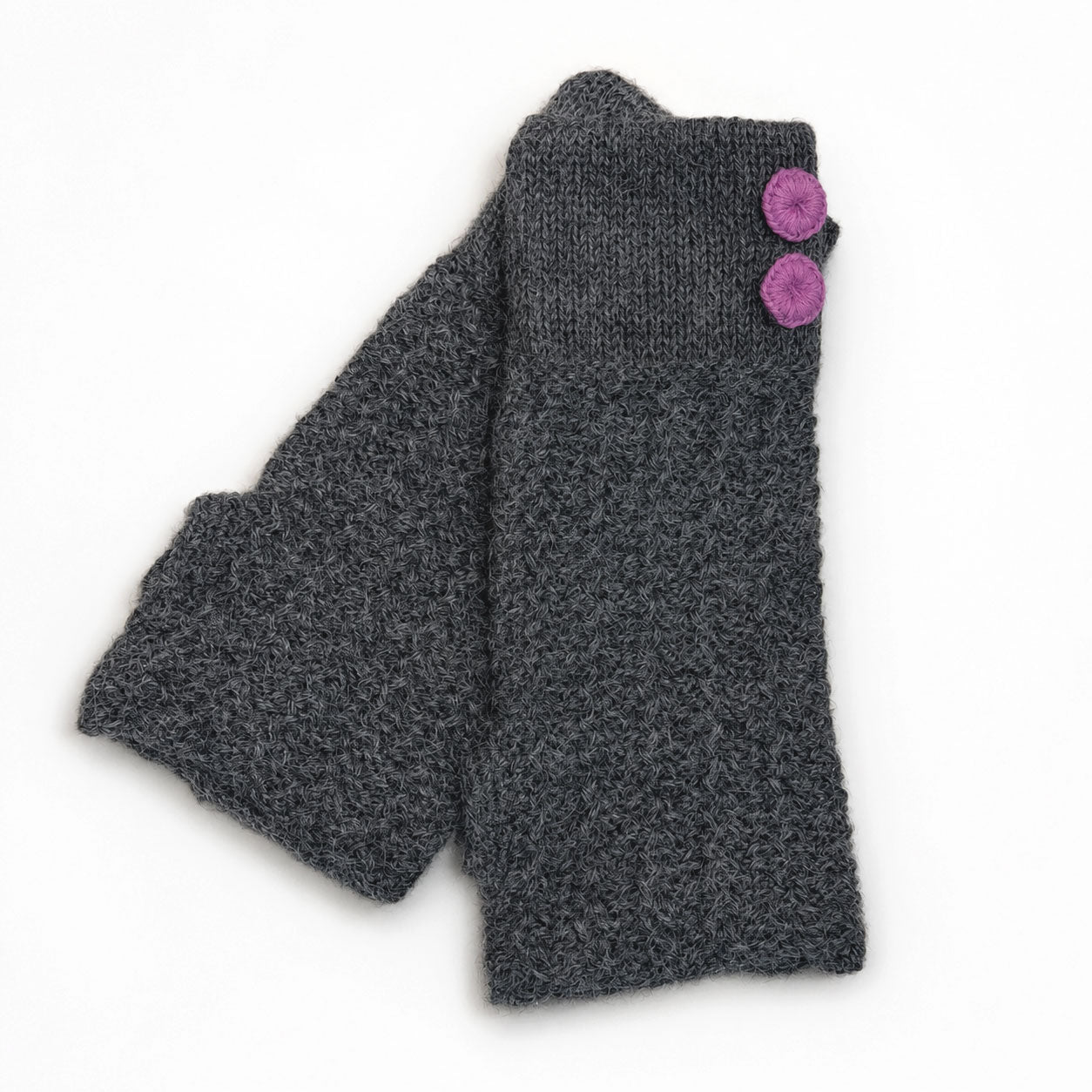 Gray knit alpaca hand warmers or gloves with purple buttons on a white background