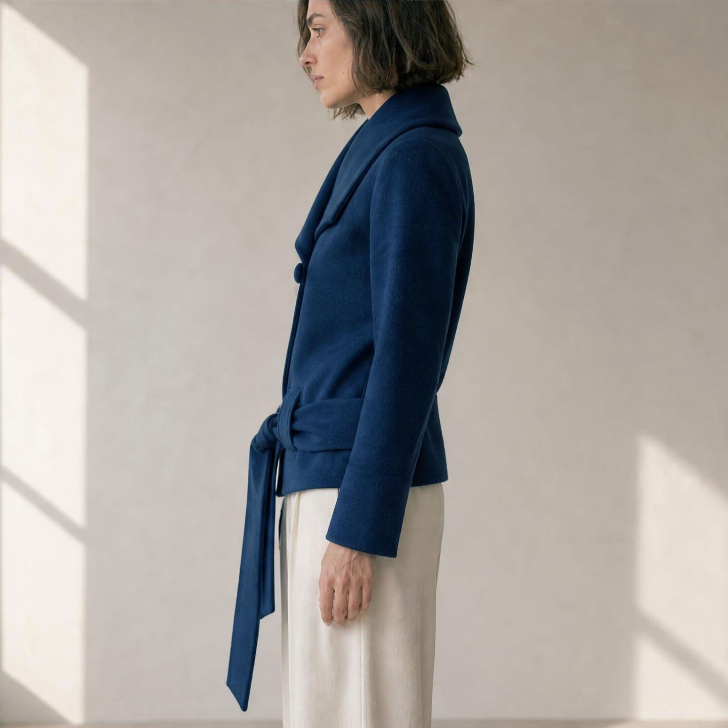 Women’s belted alpaca jacket with large collar and neckline button