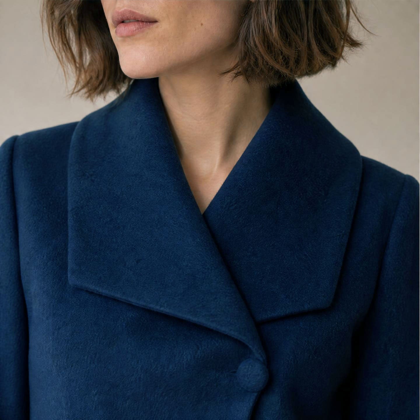 Women’s belted alpaca jacket with large collar and neckline button