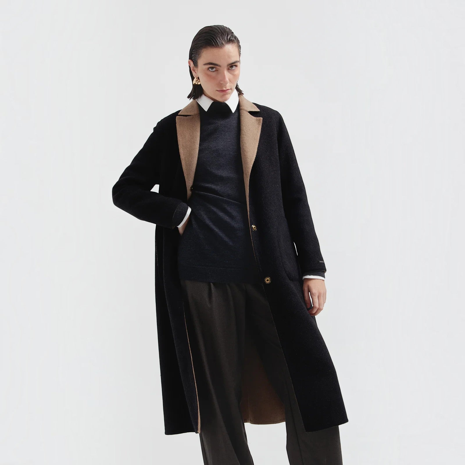 Caviar reversible alpaca coat showing black outer side and camel contrast trim