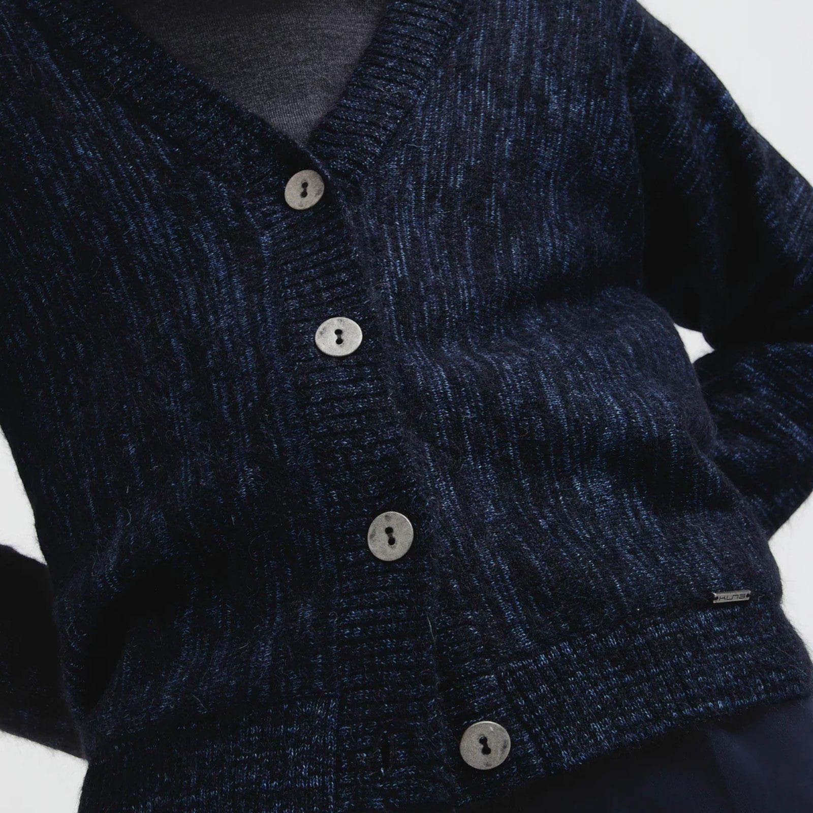 Close up of Celine lightweight alpaca blend cardigan in Black with buttons