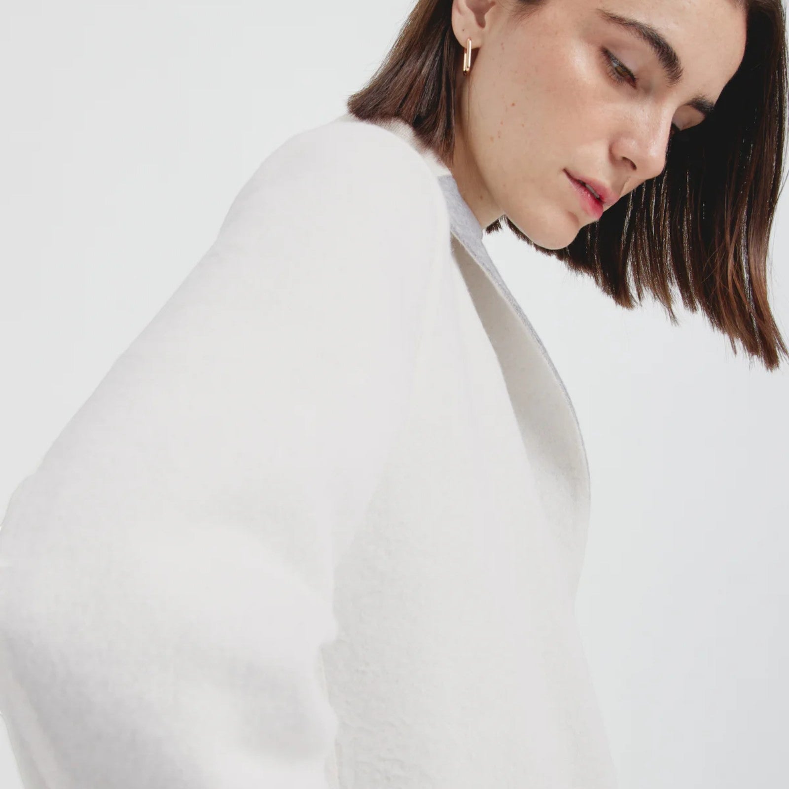 Close-up of Women’s Chantal alpaca coat with versatile grey and white reversible design
