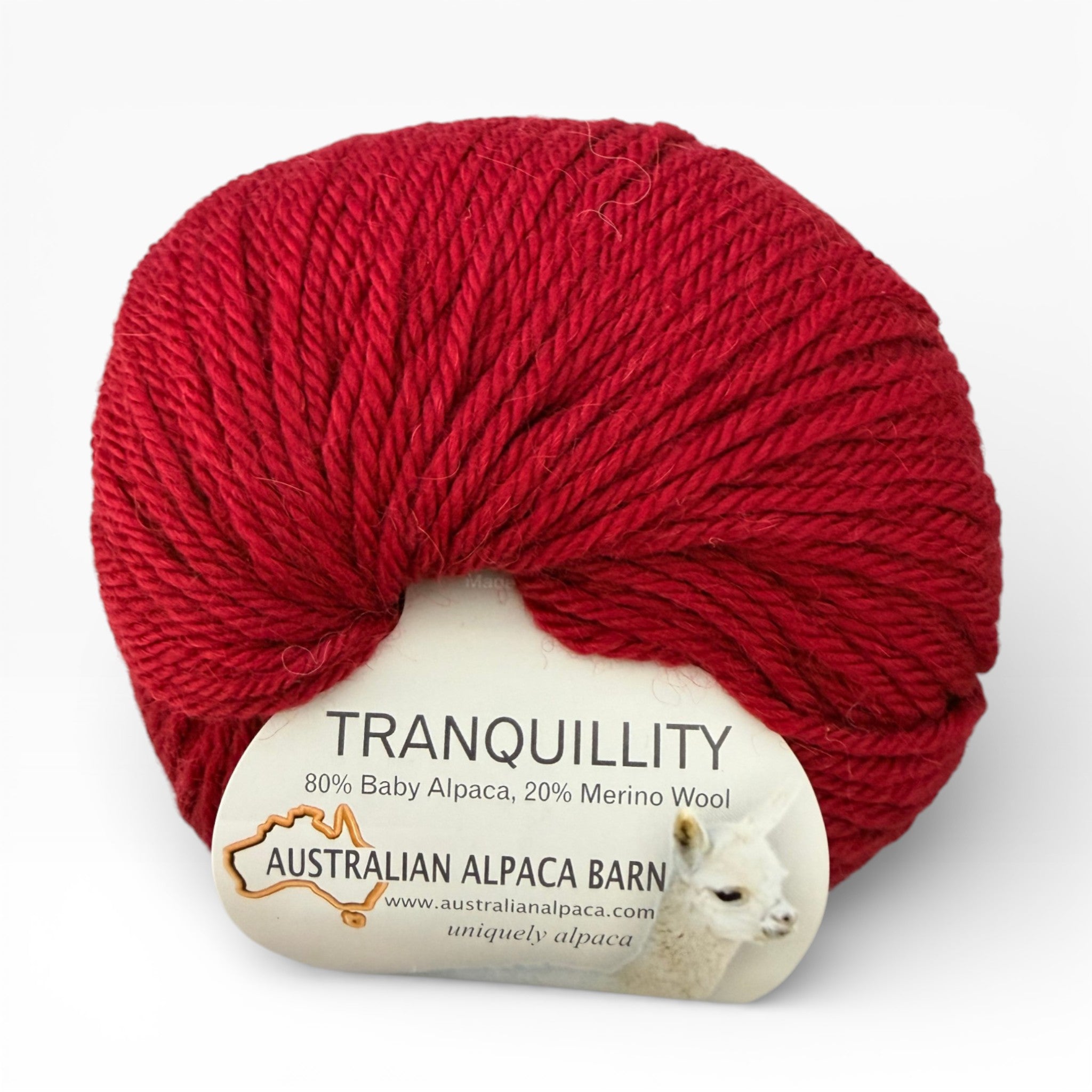 Cherry Red Alapca yarn ball with 'Tranquillity' label on a white background