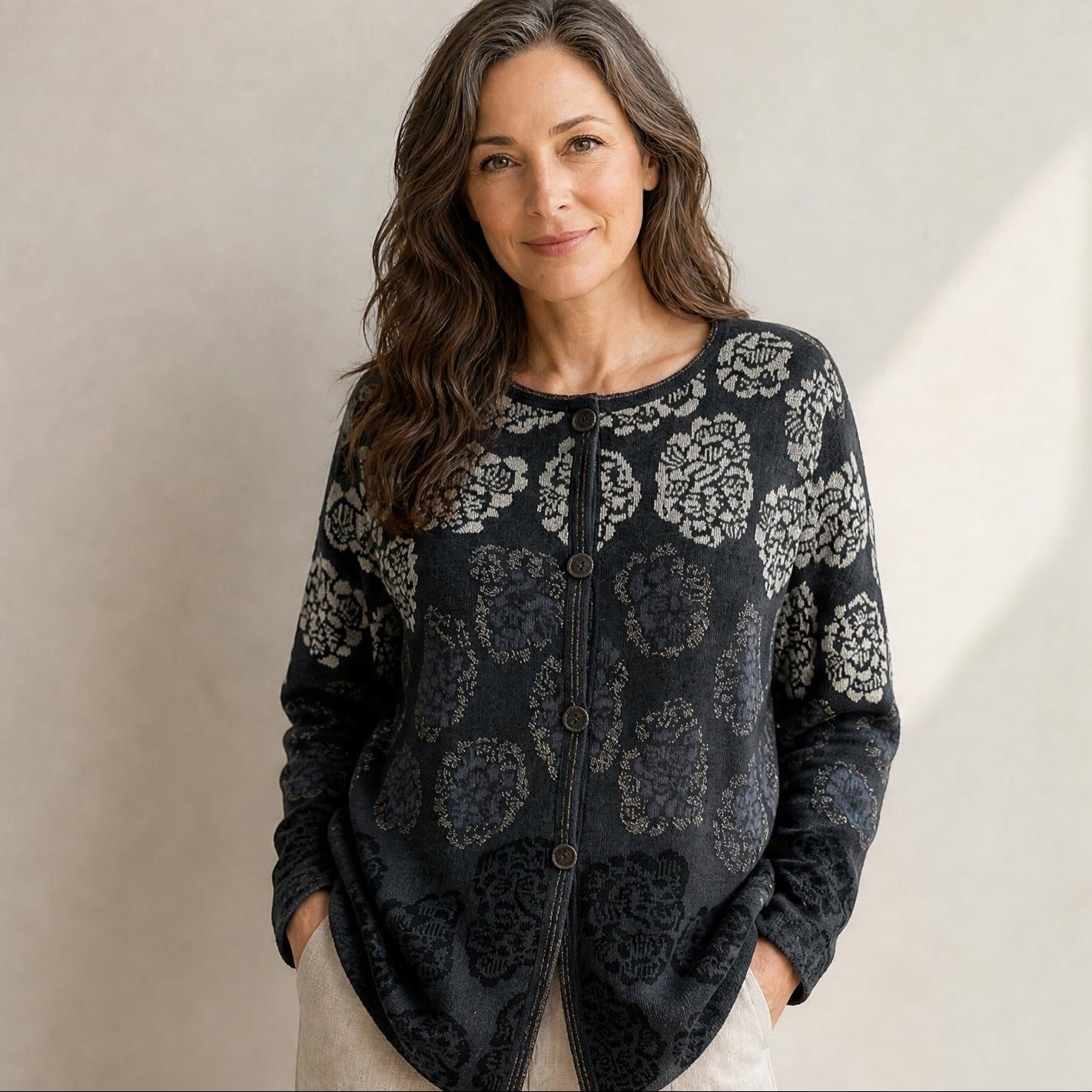 Chrysanthemum cardigan in dark floral alpaca knit worn by female model