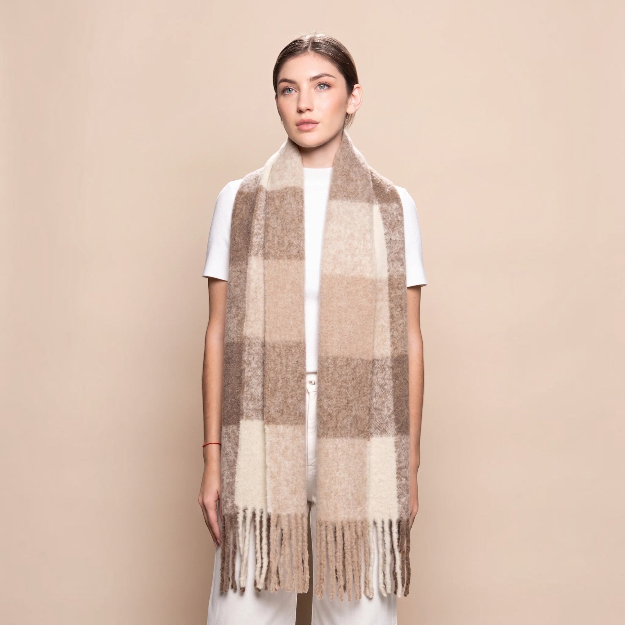 Woman wearing a chunky brown and beige alpaca blend scarf