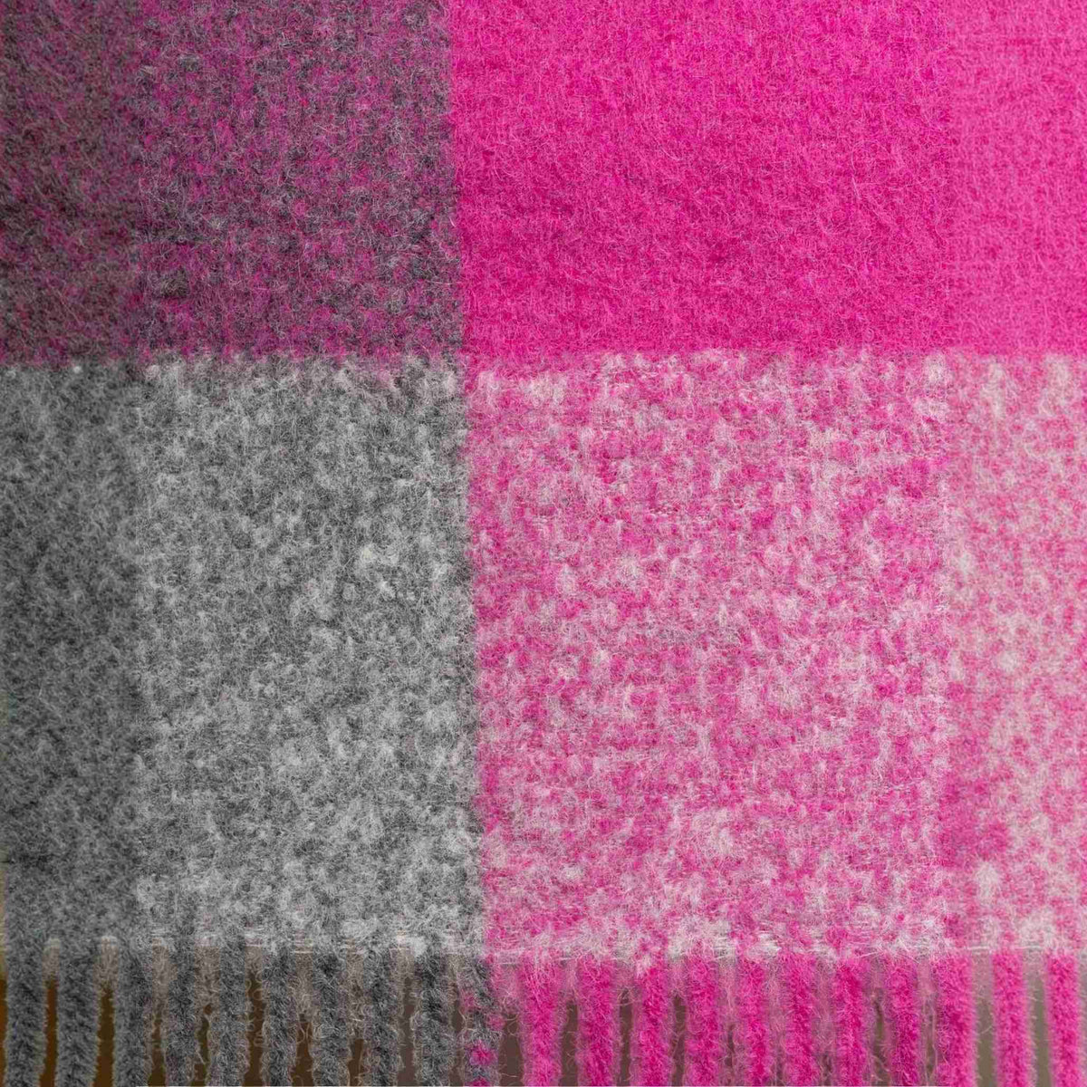 Swatch of Chunky alpaca blend plaid scarf in fuchsia and grey