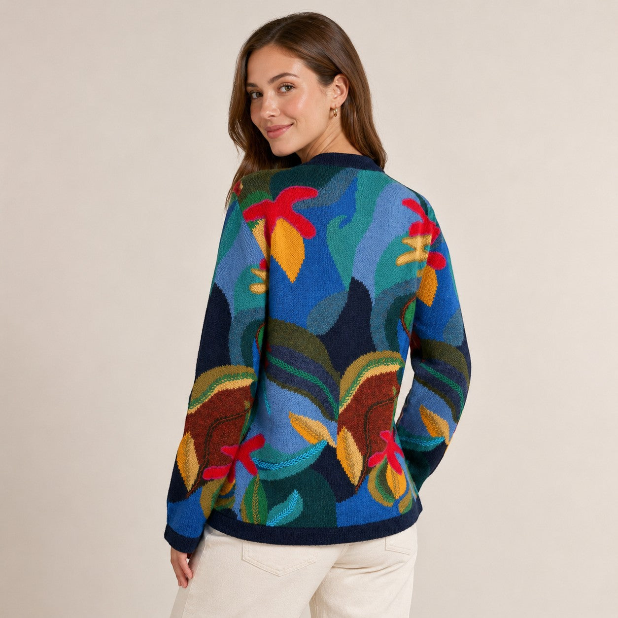 Woman wearing soft winter cardigan with multicolour intarsia design