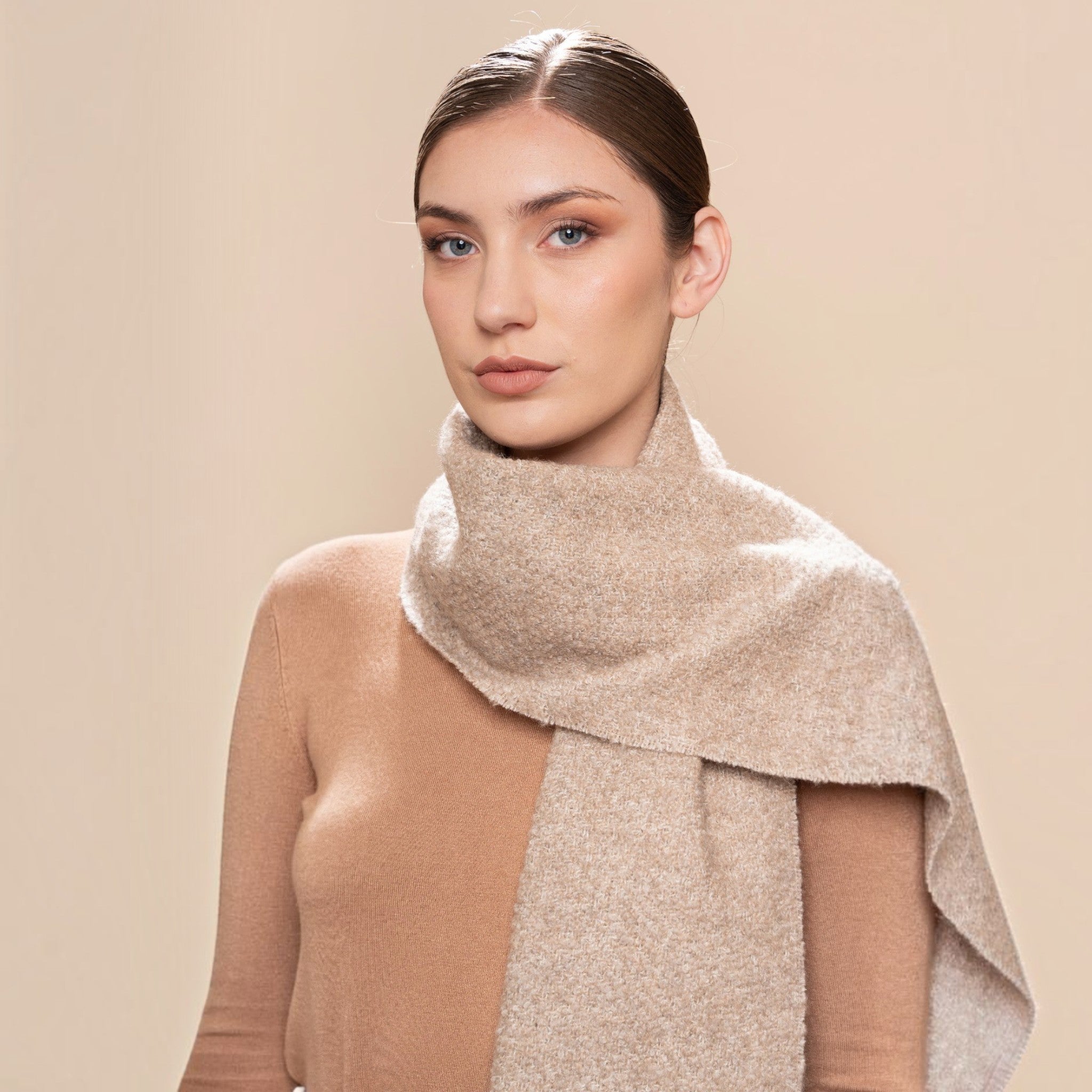 Natural oatmeal alpaca and silk bouclé scarf styled with warm neutral clothing