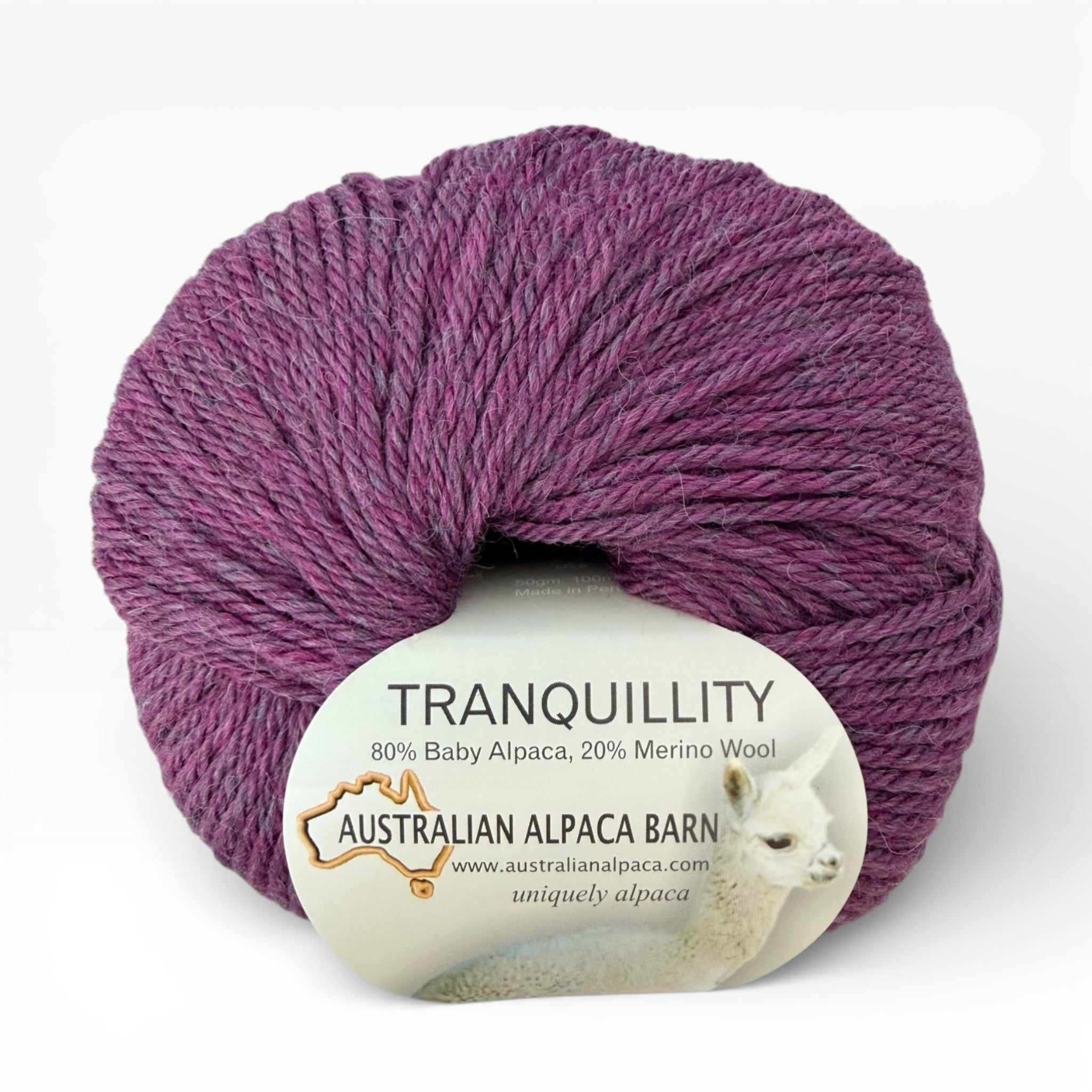 Purple alpaca yarn ball with 'Tranquillity' label on a white background