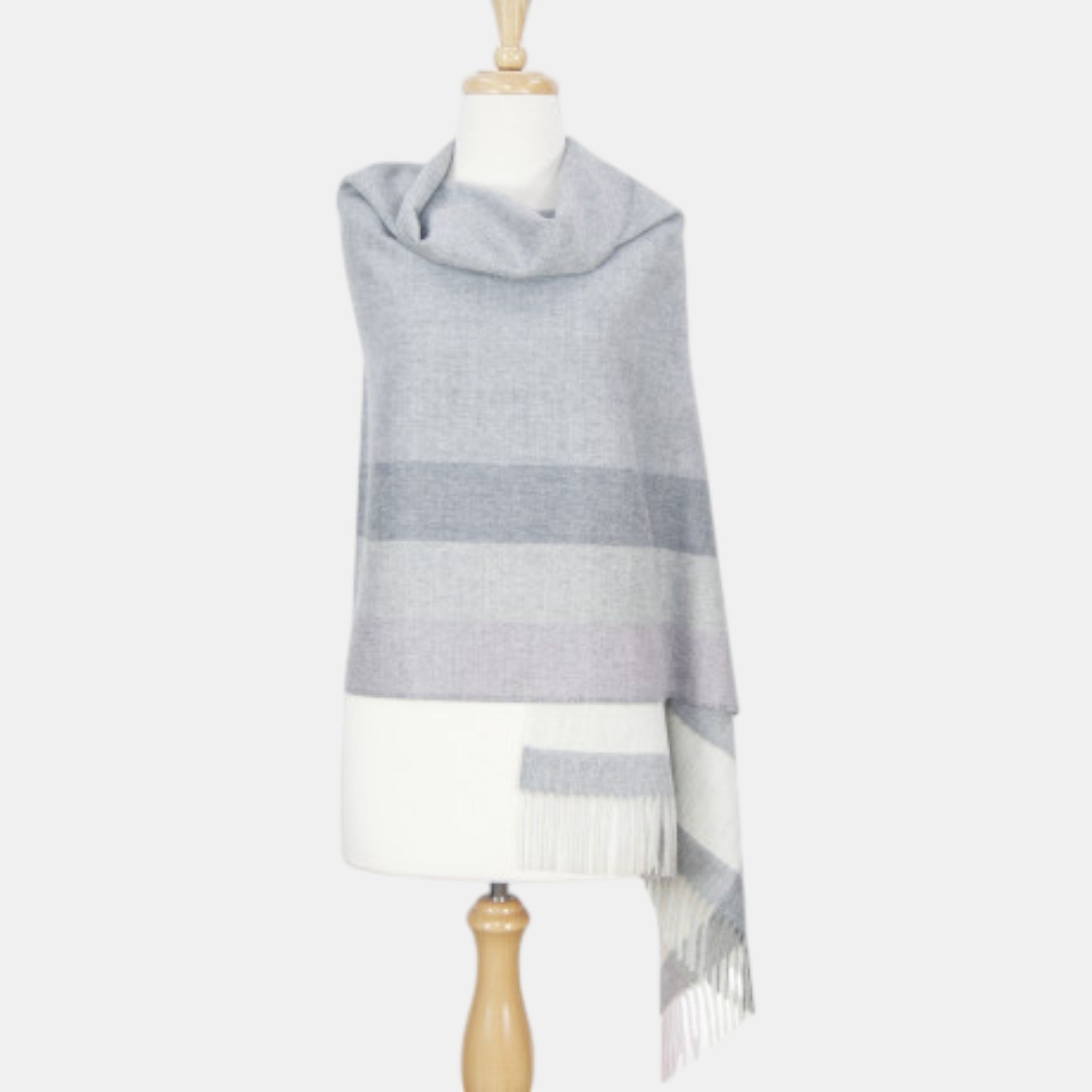 Gray striped Baby Suri alpaca shawl in soft beige, luxurious natural fibre accessory.