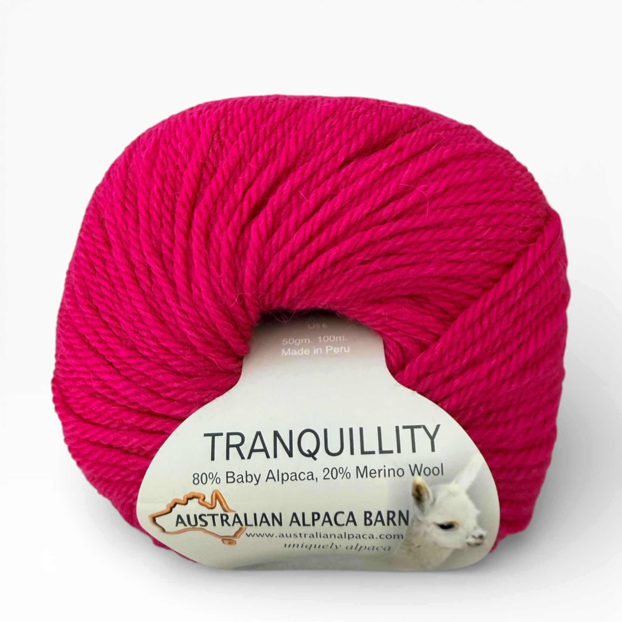 Ball of pink yarn with 'Australian Alpaca Barn' label on a white background