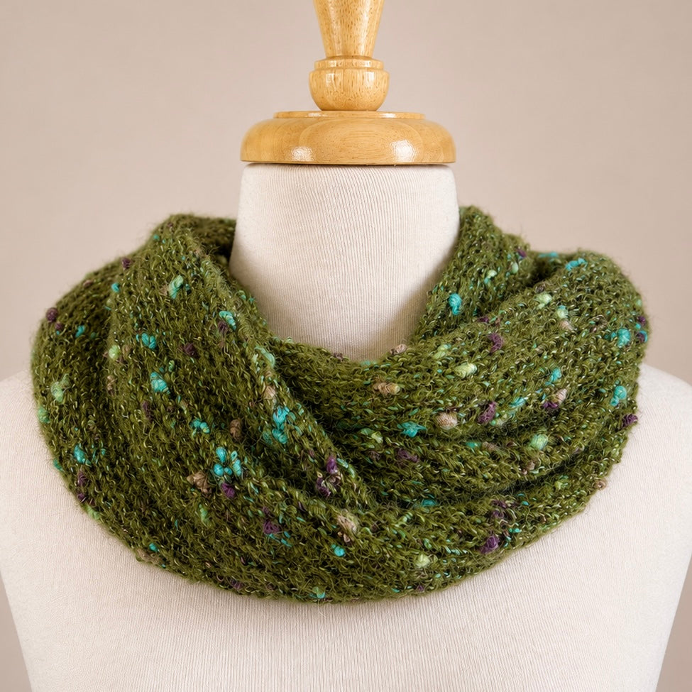 Australian Made Indulge Bouclé Alpaca Cowl in Forest Green with soft boucle texture and colourful flecked yarn.