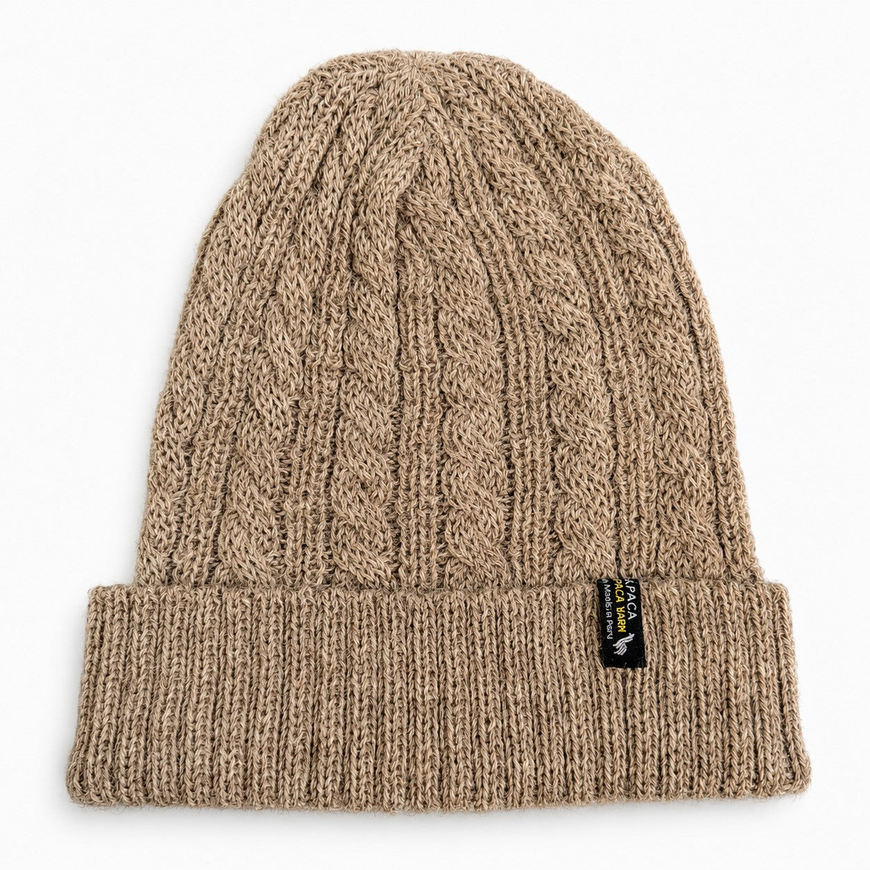 Soft cable alpaca beanie for winter warmth in Polvo