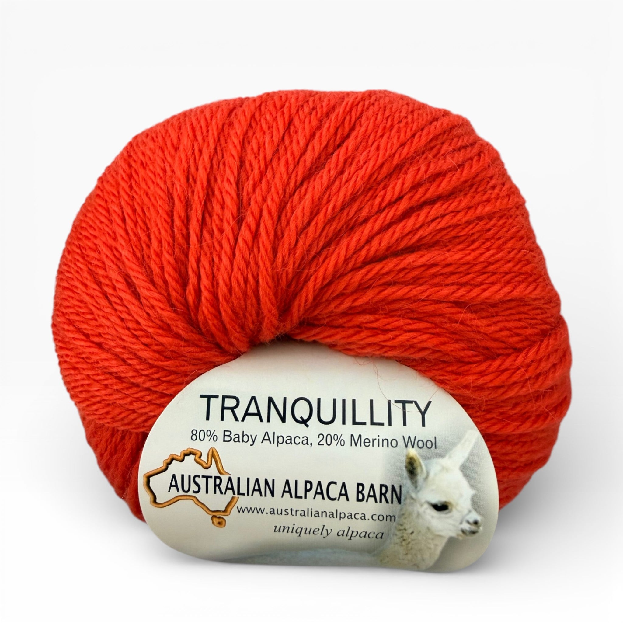 orange alpaca yarn ball with 'Tranquillity' label on a white background