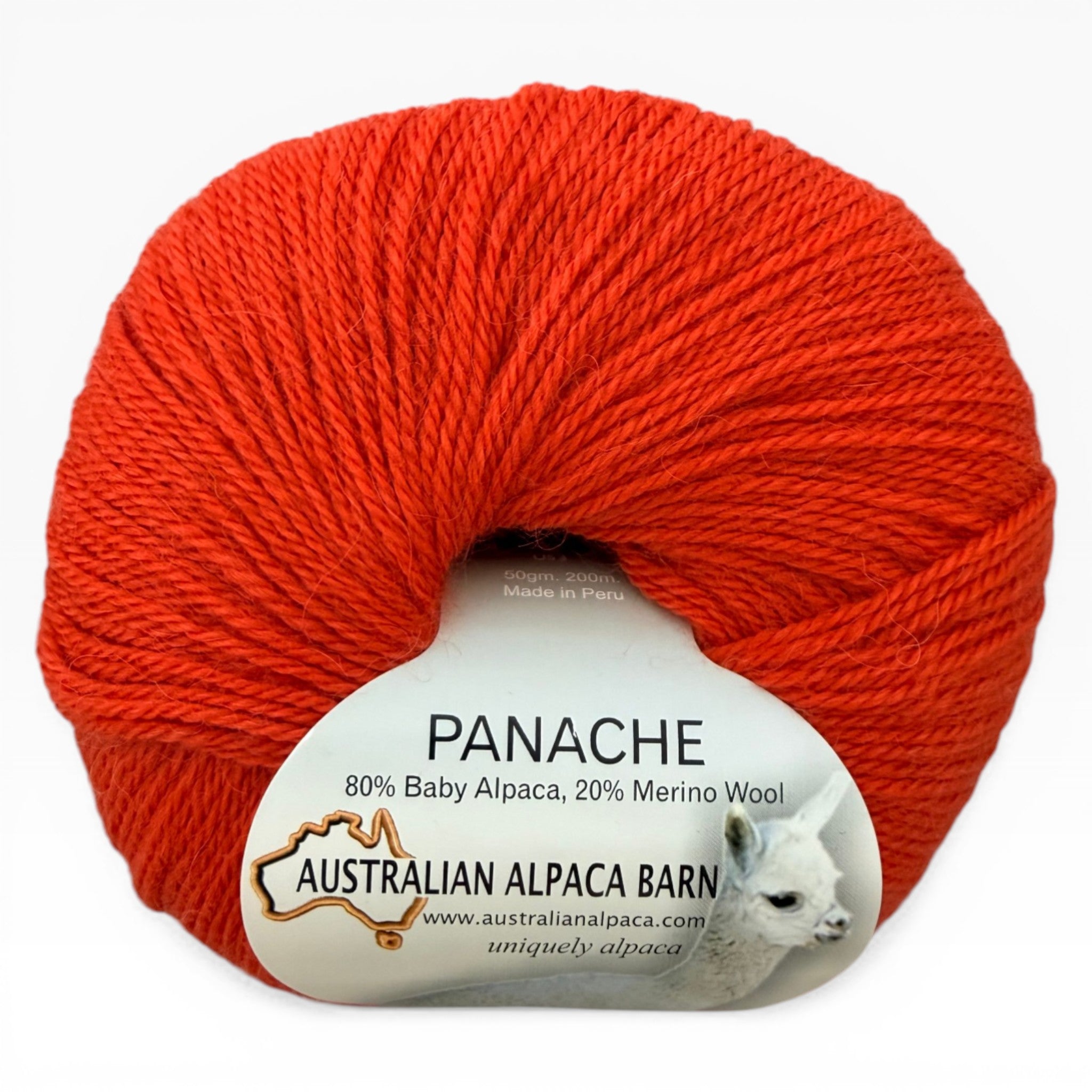 Red skein of yarn with Panache label on a white background