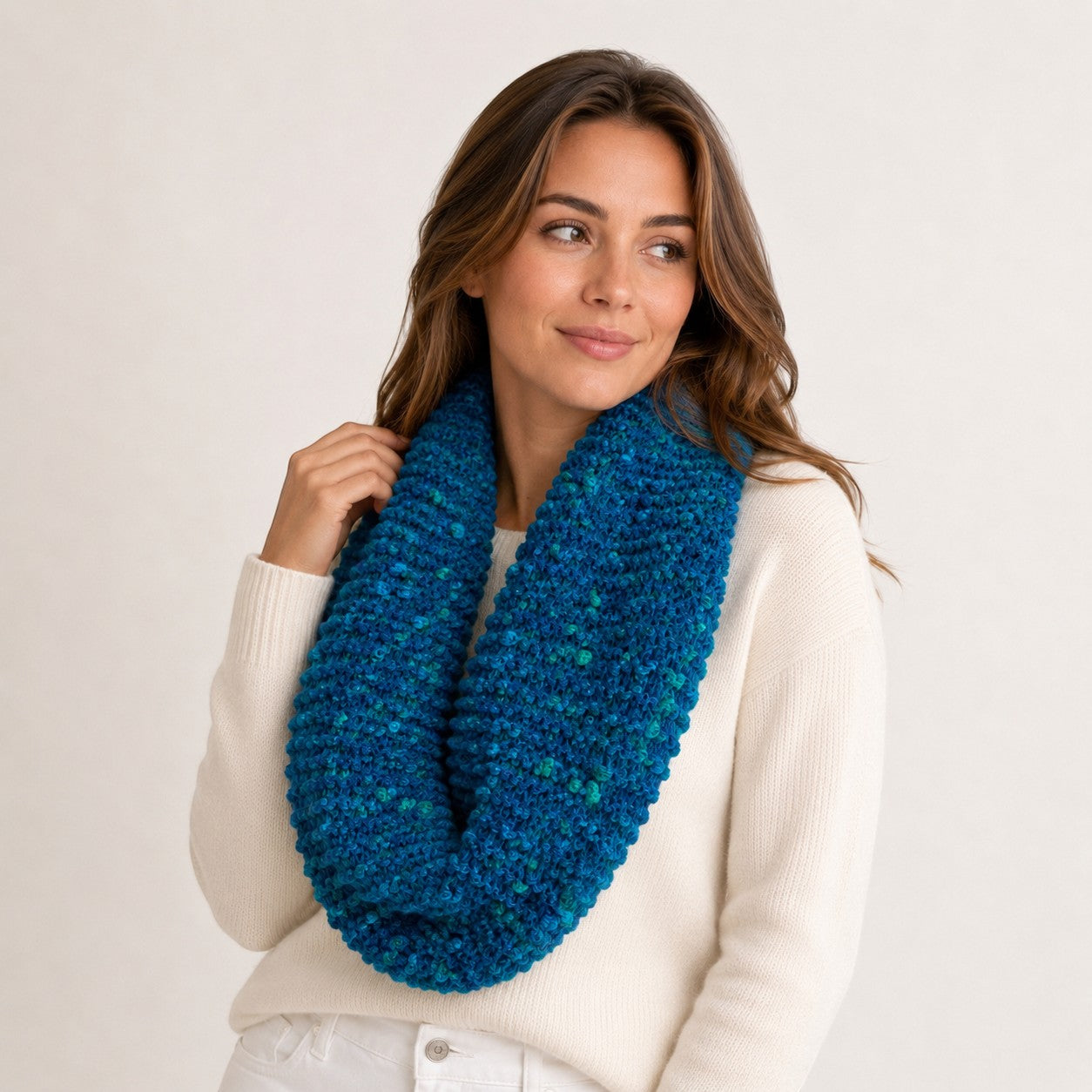 Hand-knitted ocean blue Baby Alpaca PomPom snood with turquoise accents