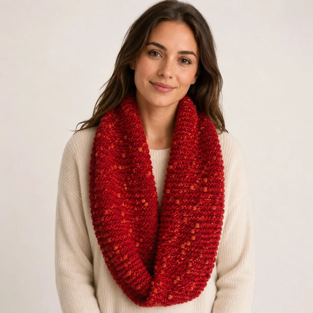 A women wearing an Alpaca PomPom Snood in Red