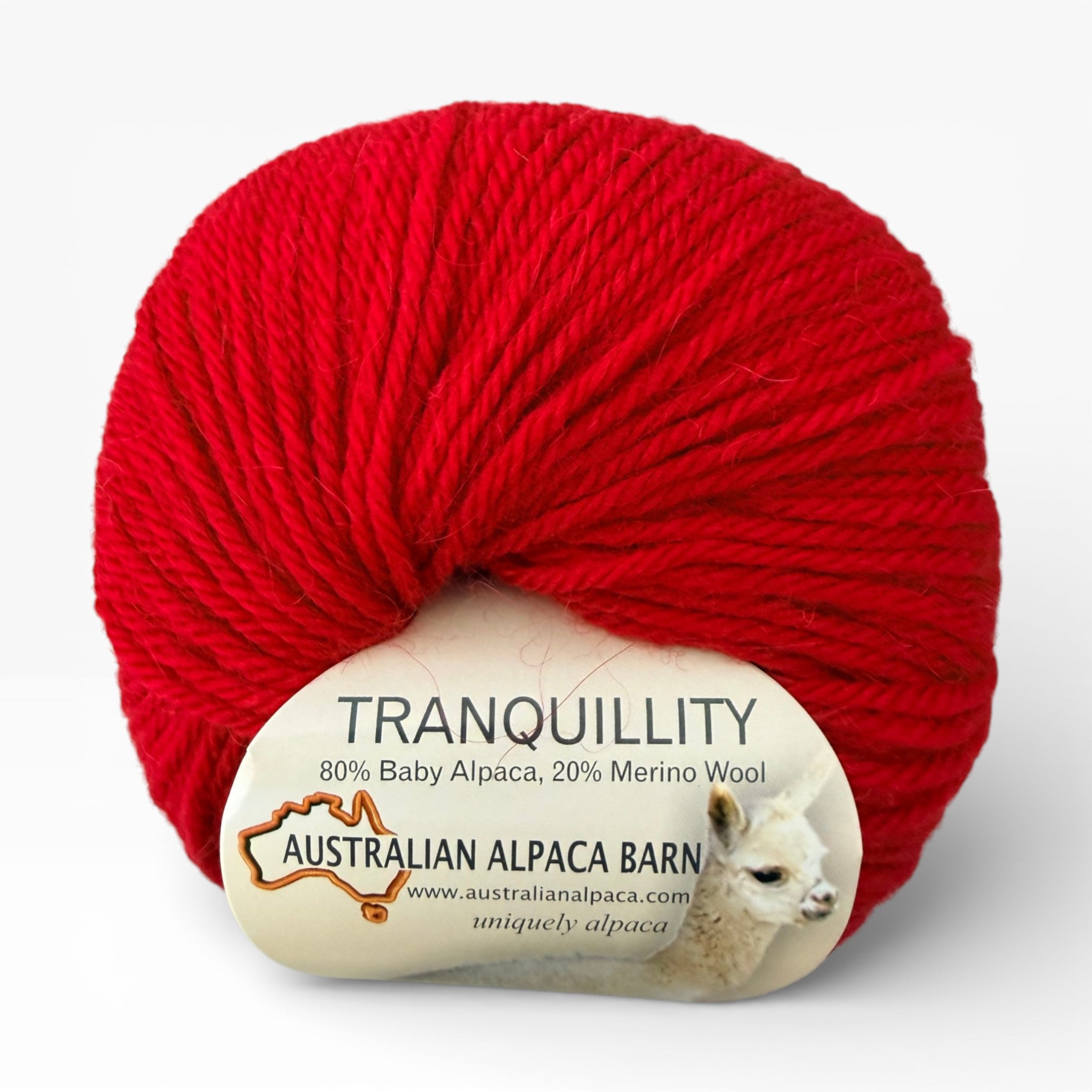 Red yarn ball with 'Tranquillity' label featuring Australian Alpaca Barn on a white background