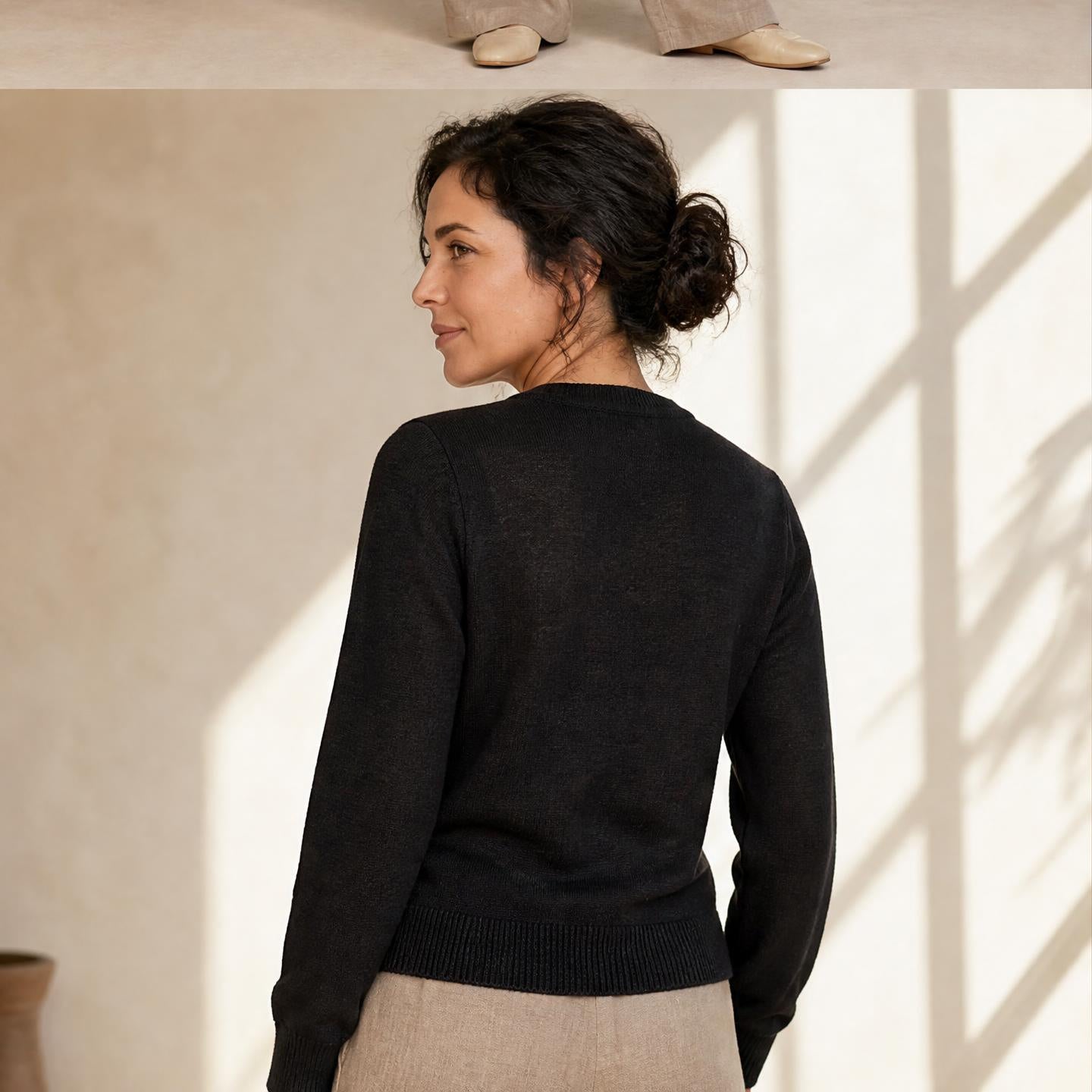 Woman wearing black Sharon baby alpaca cardigan with button front