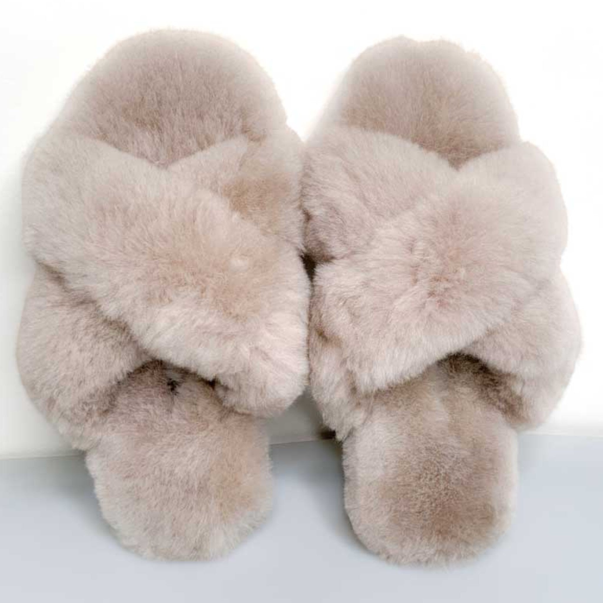 Crossed Huacaya alpaca fur slippers in a natural sand colour with plush crossover straps