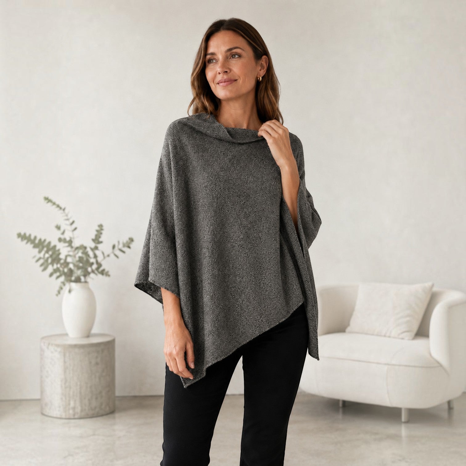 Grey 100% alpaca poncho with a bateau neckline and relaxed silhouette