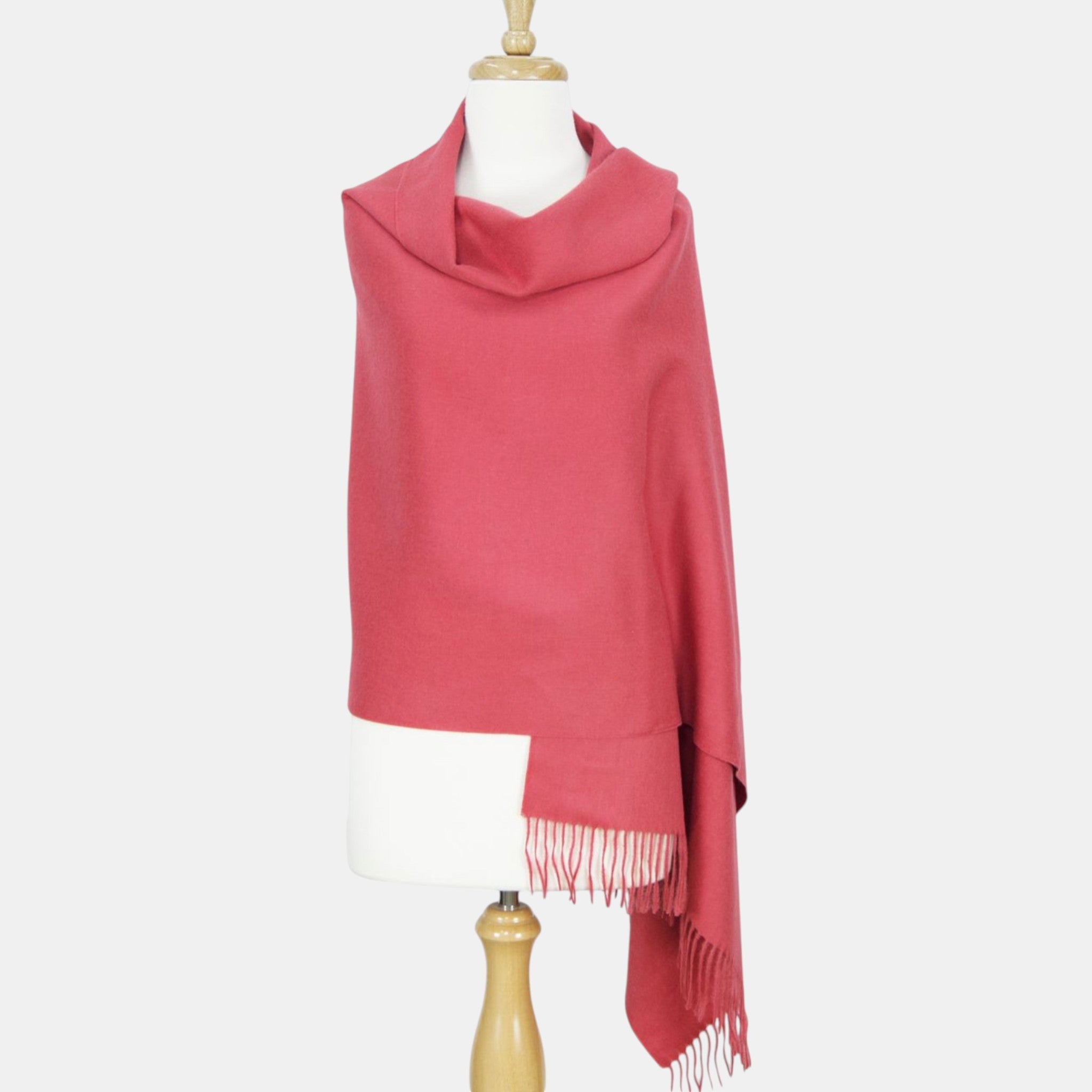 Soft Suri alpaca shawl in soft red tones, lightweight luxury winter wrap.