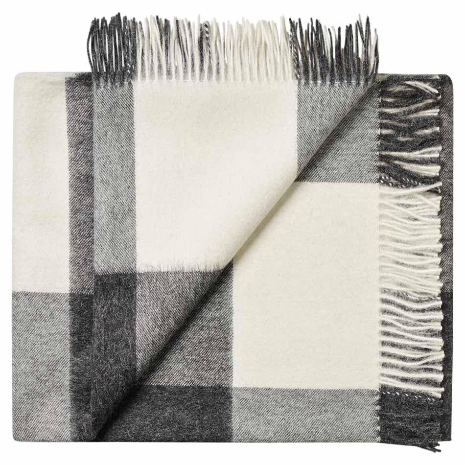 Black and white baby alpaca checkered blanket with fringed edges a warm winter gift