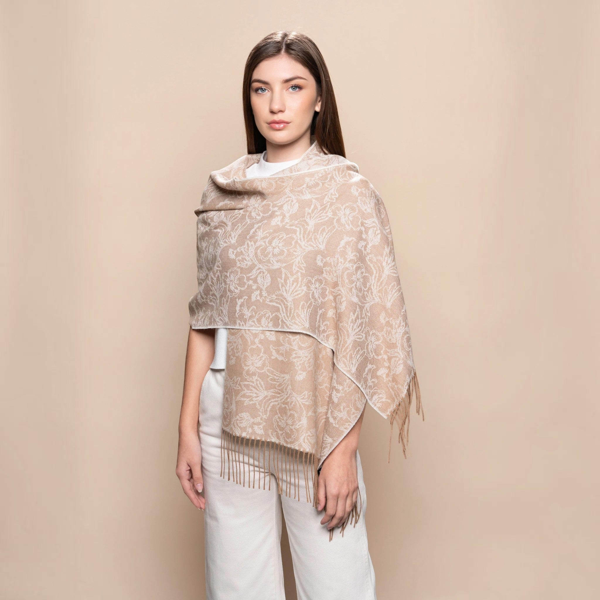 Undyed beige Baby Alpaca scarf styled as a wrap with delicate floral jacquard detail