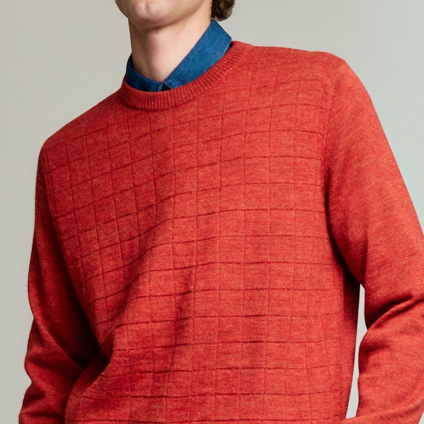 Close up of Yale crew-neck sweater in Secoya red, made from 100% Baby Alpaca