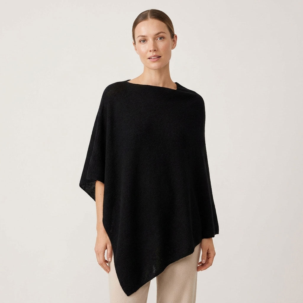 Sorpresa black alpaca poncho showing its relaxed fit and draped silhouette