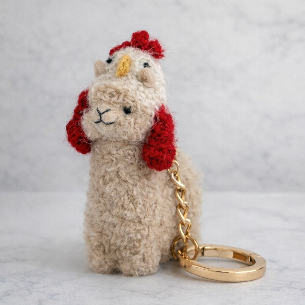 Needle felted alpaca keychain with colourful chicken hat