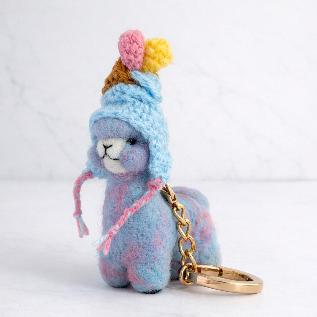 Small needle felted alpaca decoration keyring wearing a icecream hat