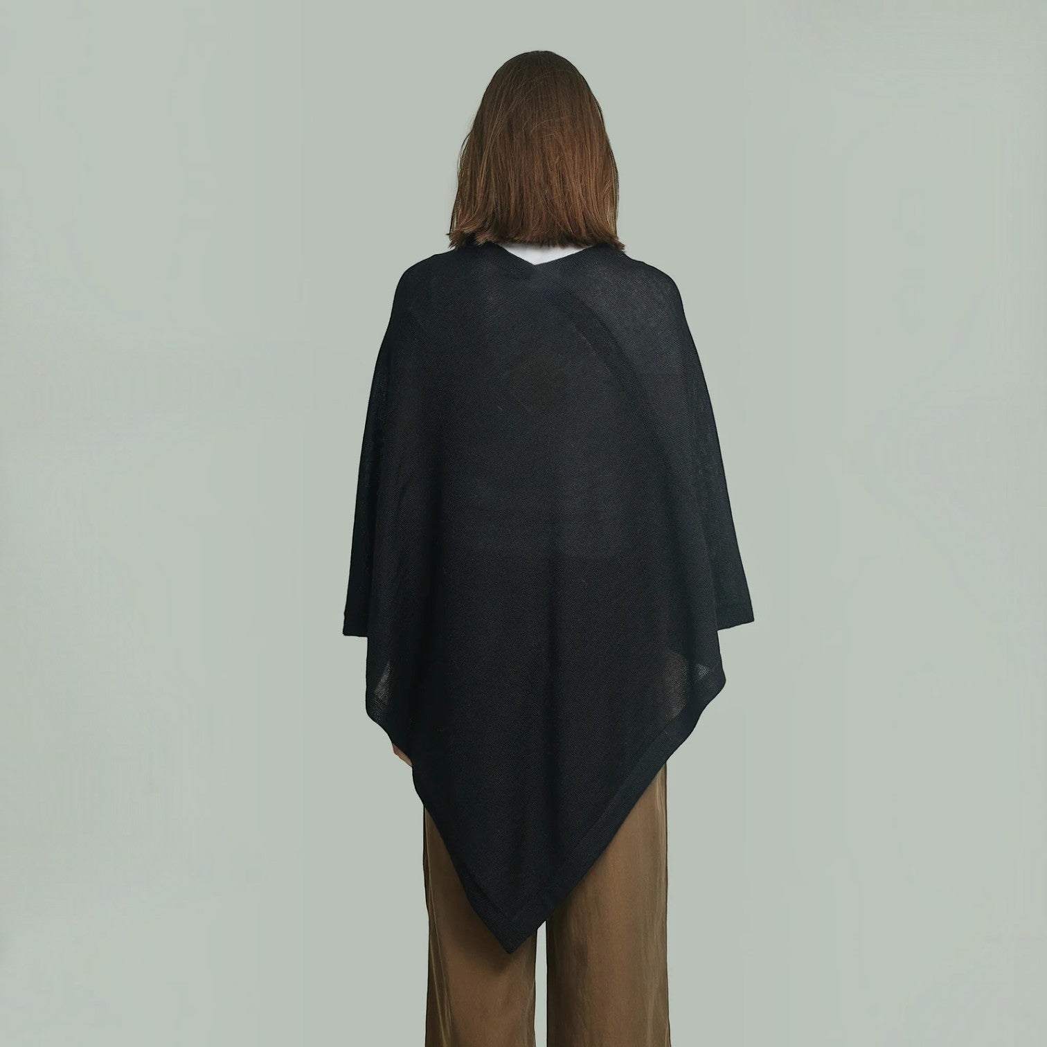 Black Baby Alpaca poncho with a soft, flowing silhouette