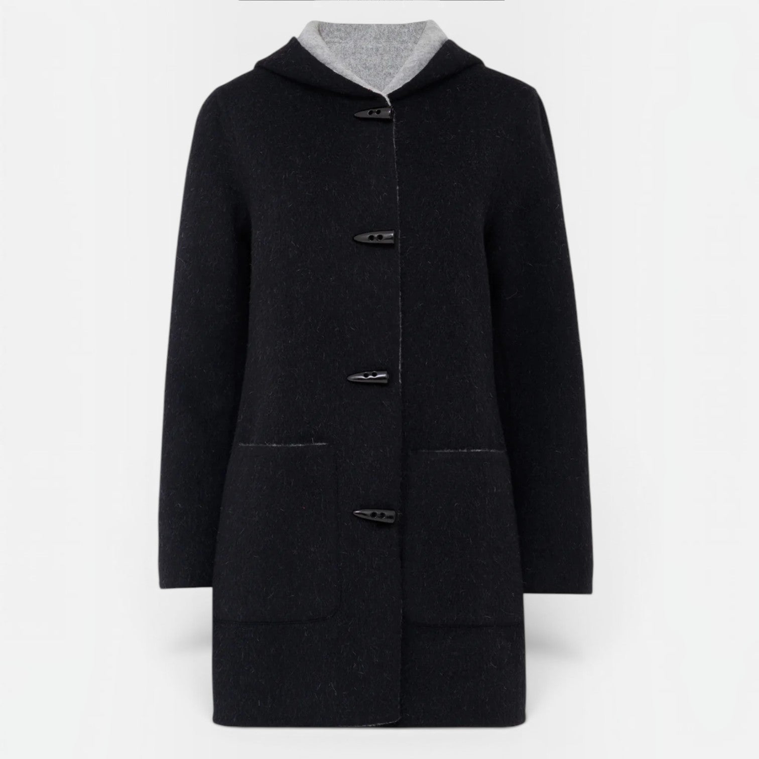 Front view of black reversible alpaca coat with contrast grey interior