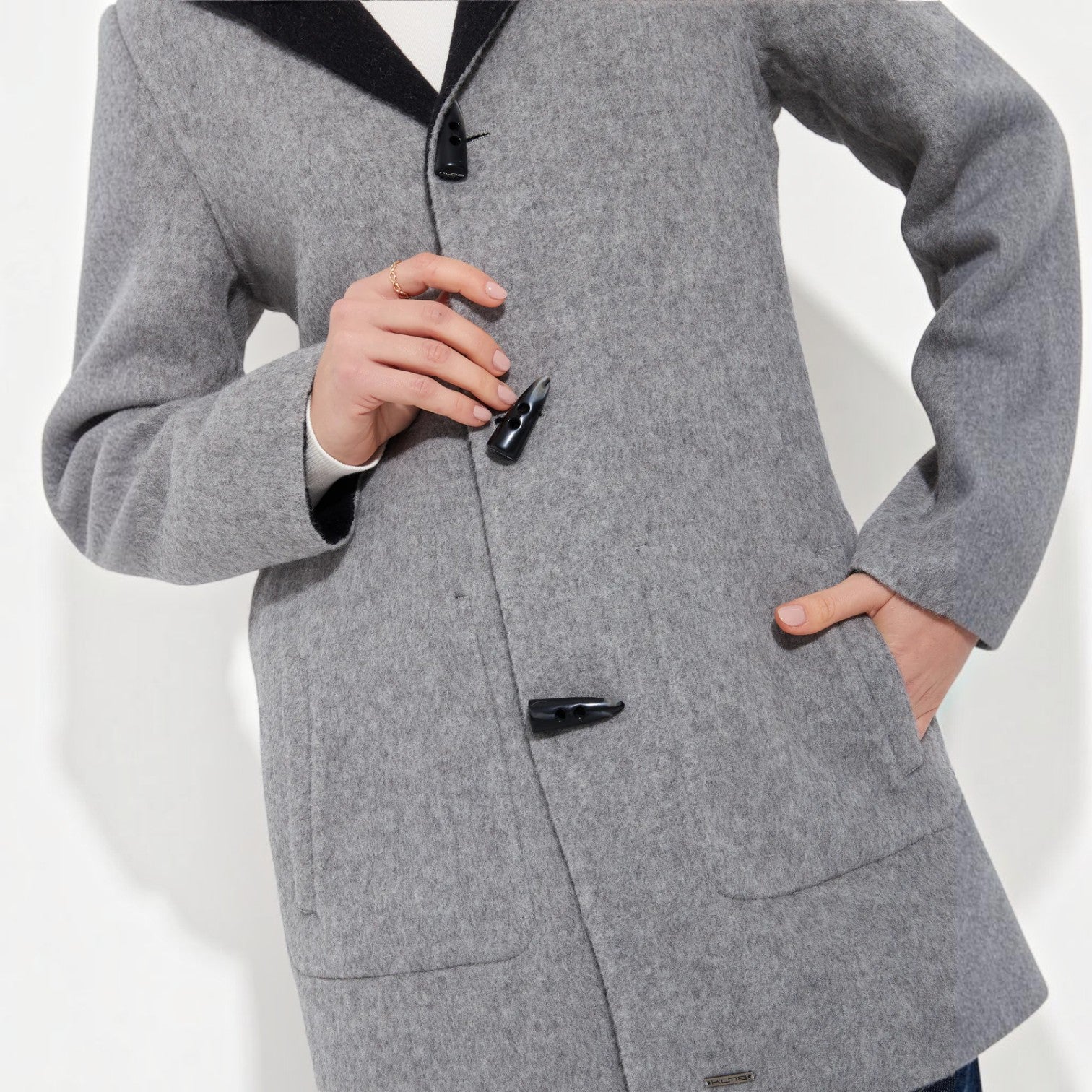Black baby alpaca coat with contrasting grey collar and toggle fastenings