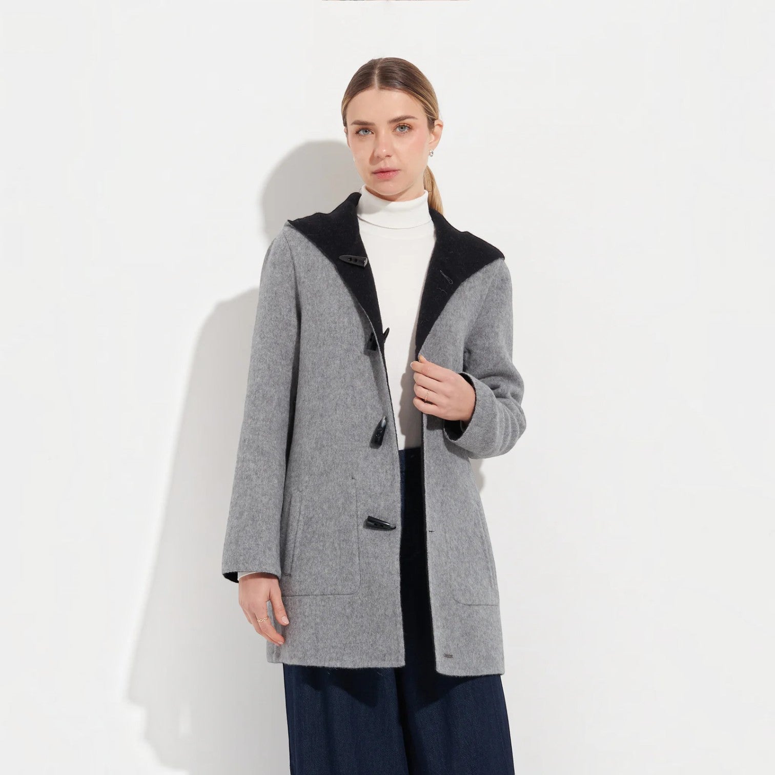 Women’s reversible baby alpaca coat in grey and black with toggle closures