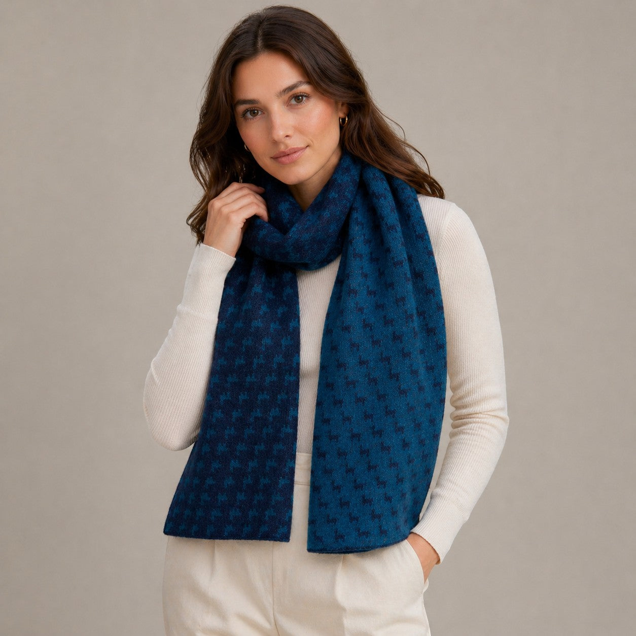 Woman wearing Australian Alpaca Barn reversible alpaca scarf in blues
