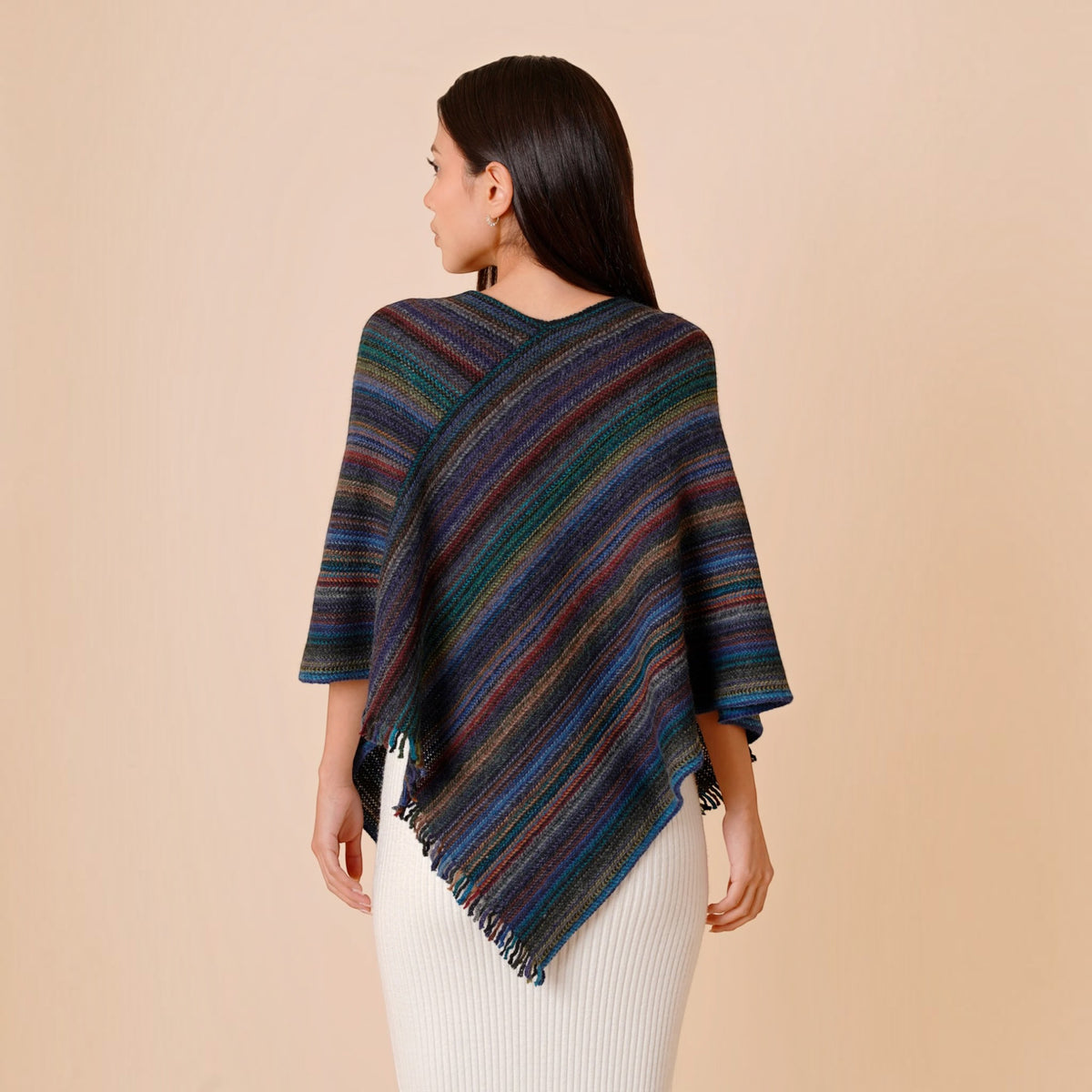 One size striped alpaca blend poncho with diagonal knit design and asymmetric hem