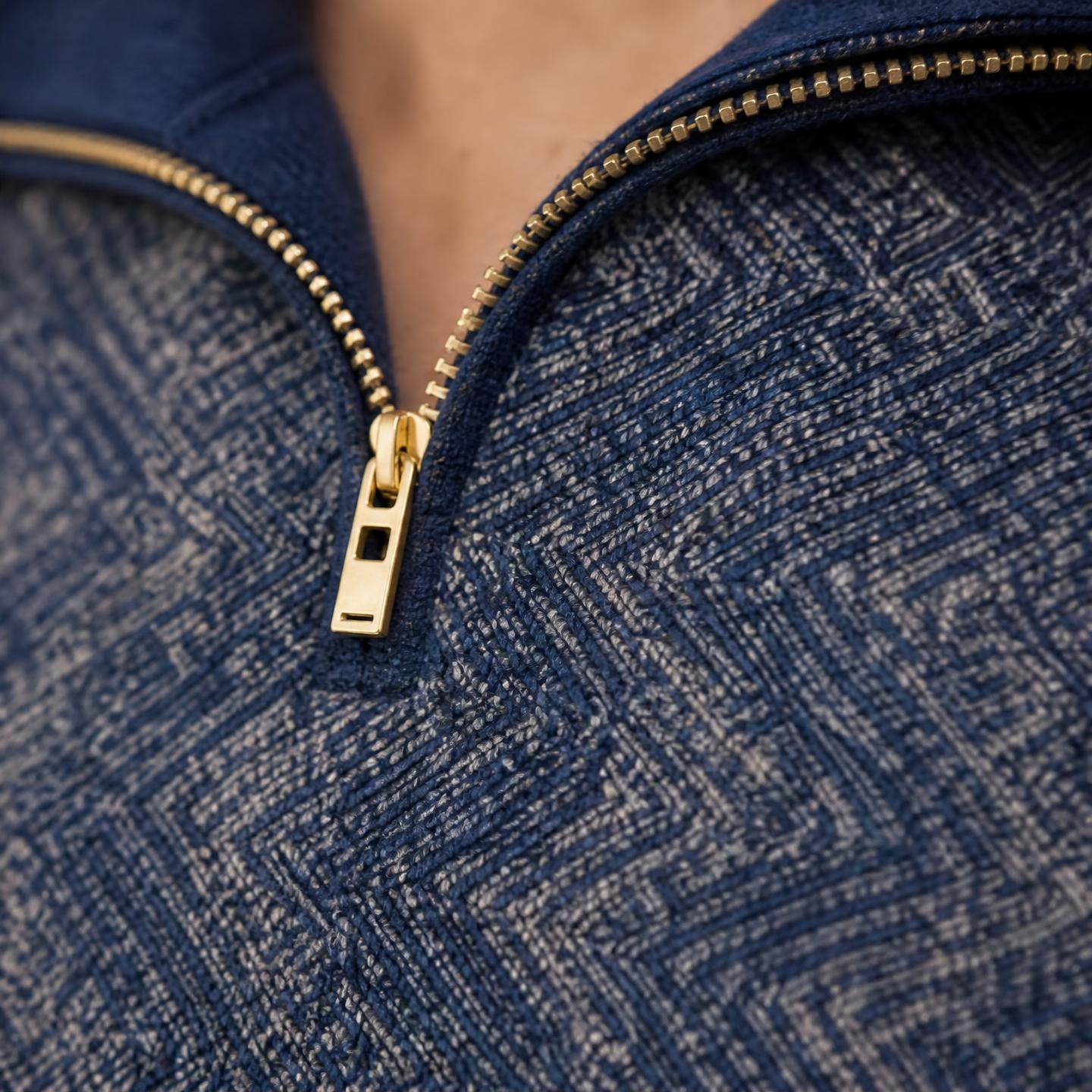 close up of Model wearing Men’s winter half zip sweater made from soft alpaca