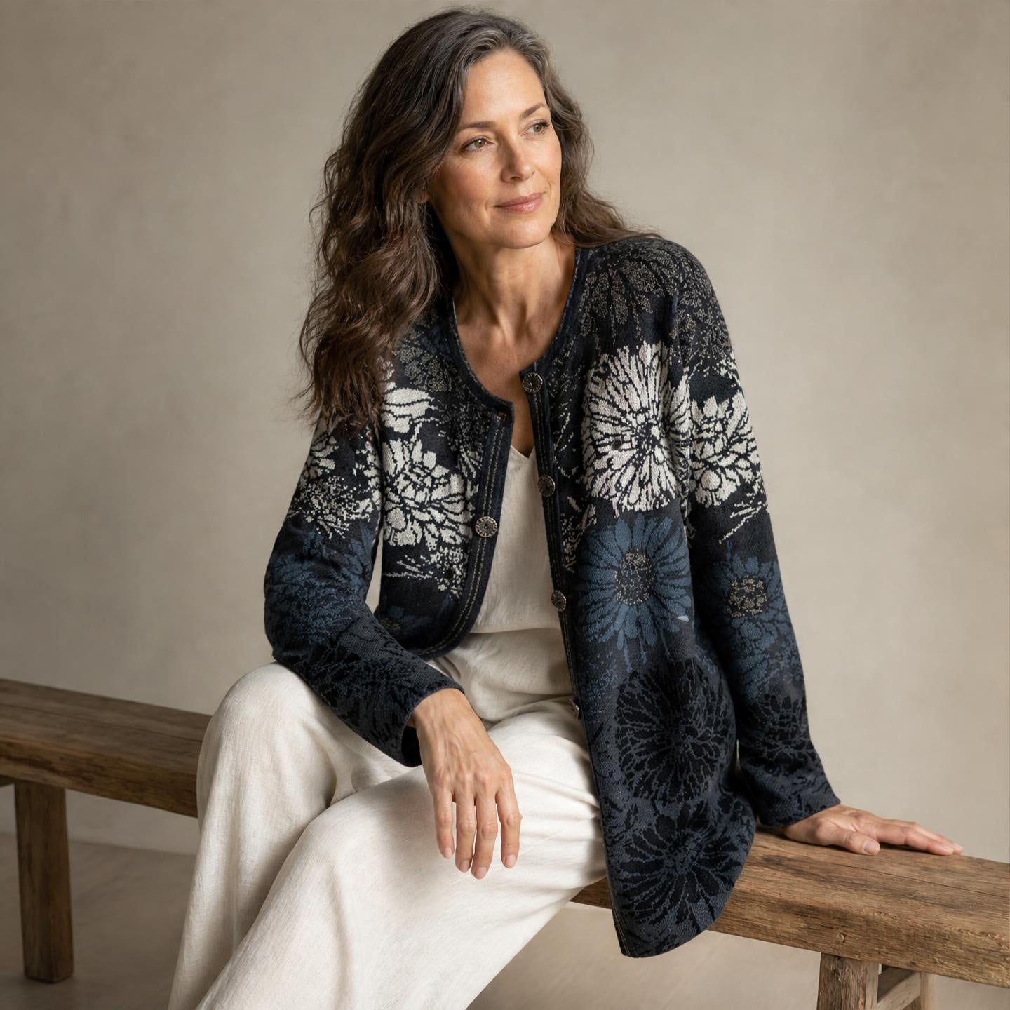 Woman wearing Annie floral alpaca cardigan in navy and cream