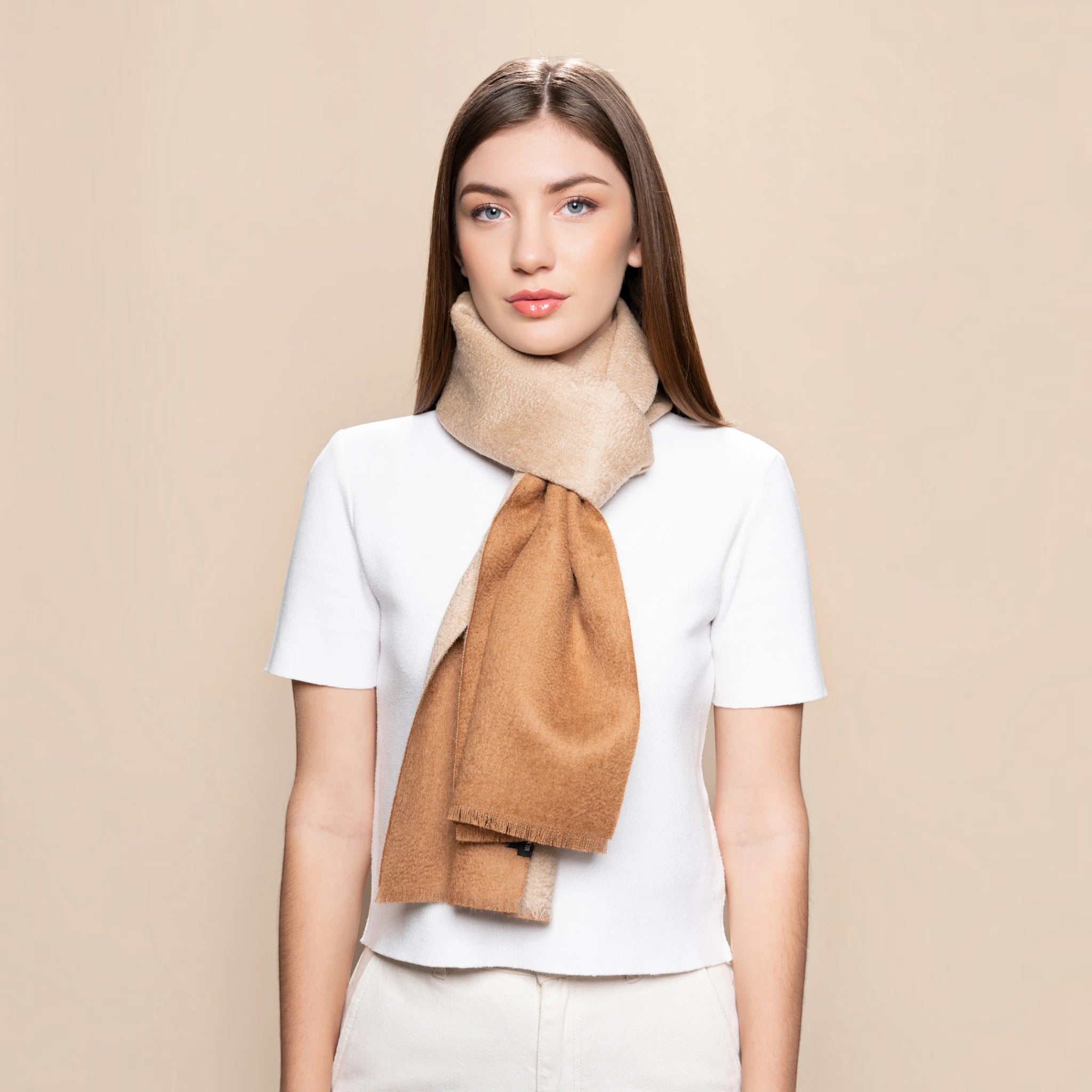 100% Baby Suri Alpaca reversible scarf in beige and camel with softly frayed edges