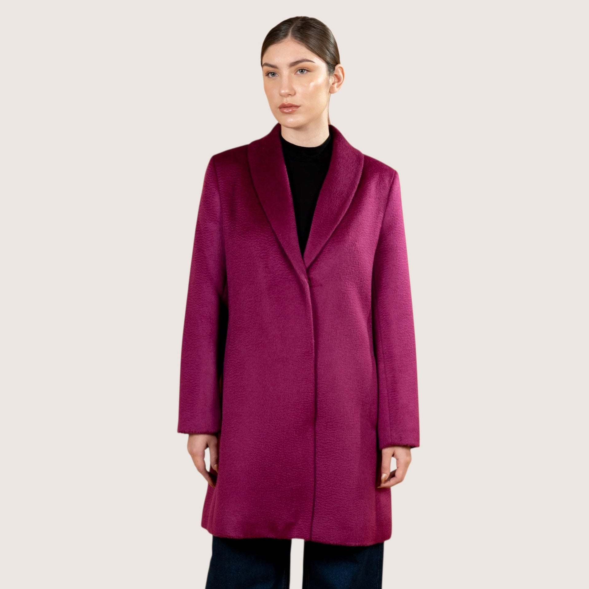 Model in pink suri alpaca coat, soft natural fibre winter coat for women.