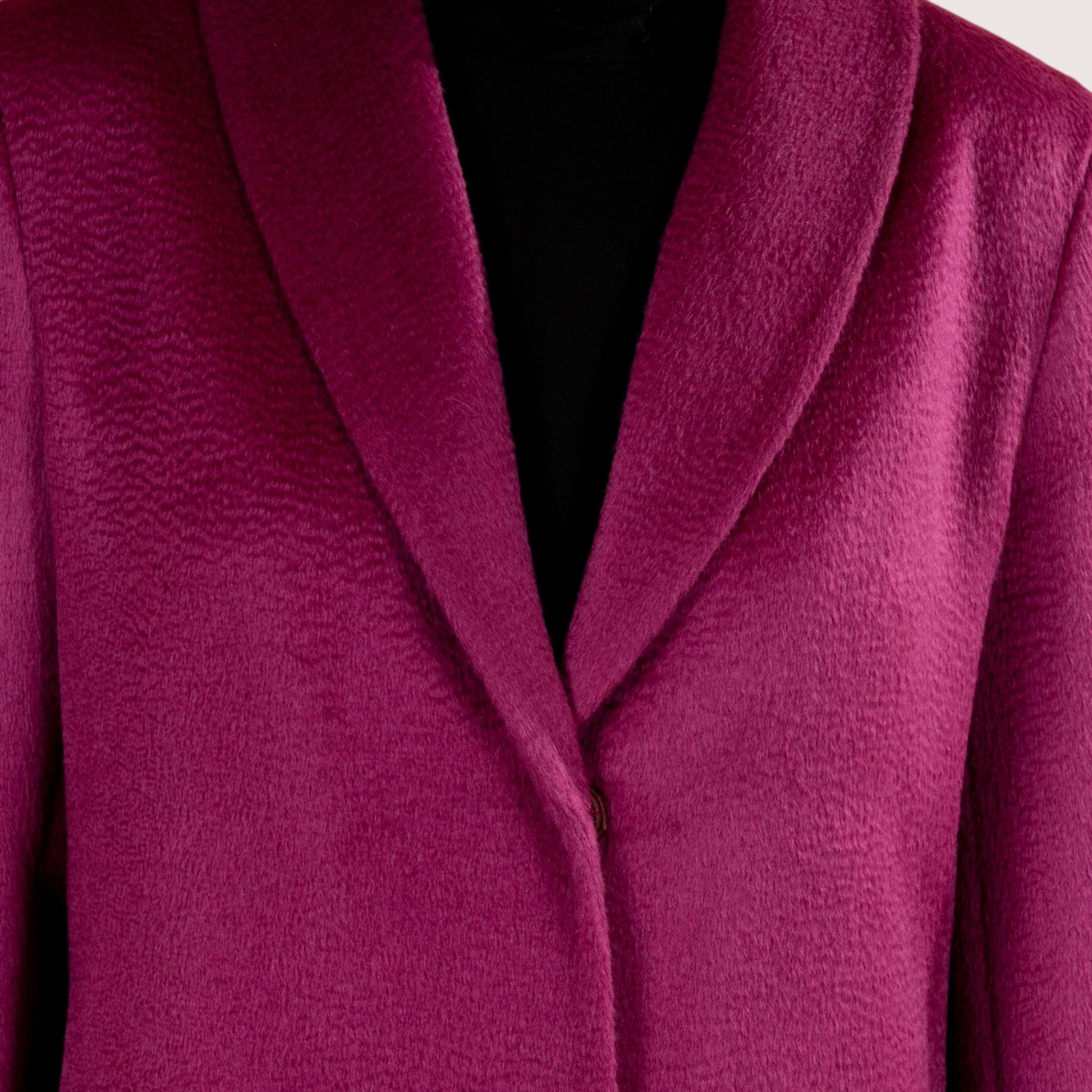 Model in Fucsia alpaca coat, soft natural fibre winter coat for women.