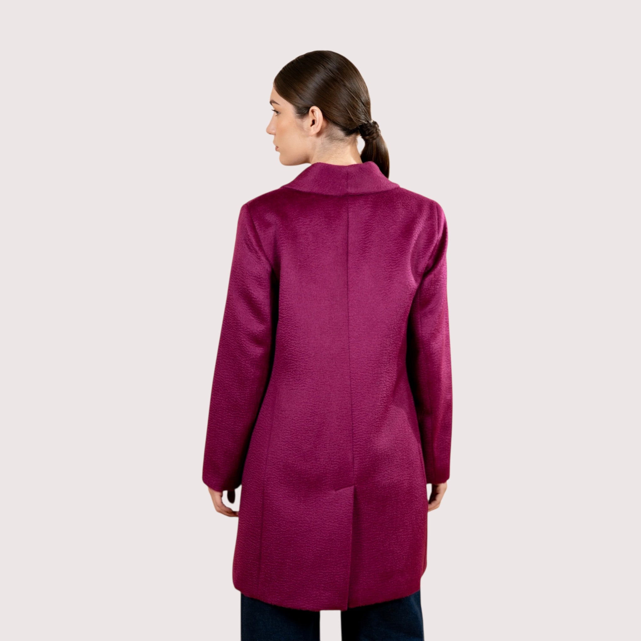 Model in hot pint alpaca coat, soft natural fibre winter coat for women.