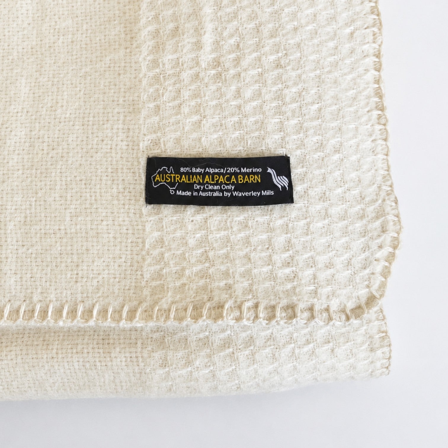 Close-up of an Australian made classic alpaca blanket showing the weave
