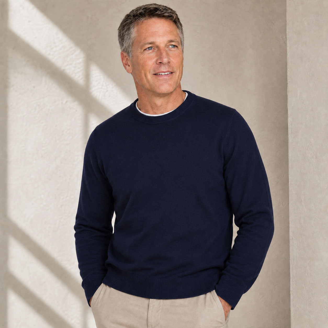 Model wearing Men’s natural fibre  crew neck sweater in alpaca cashmere blend in Navy