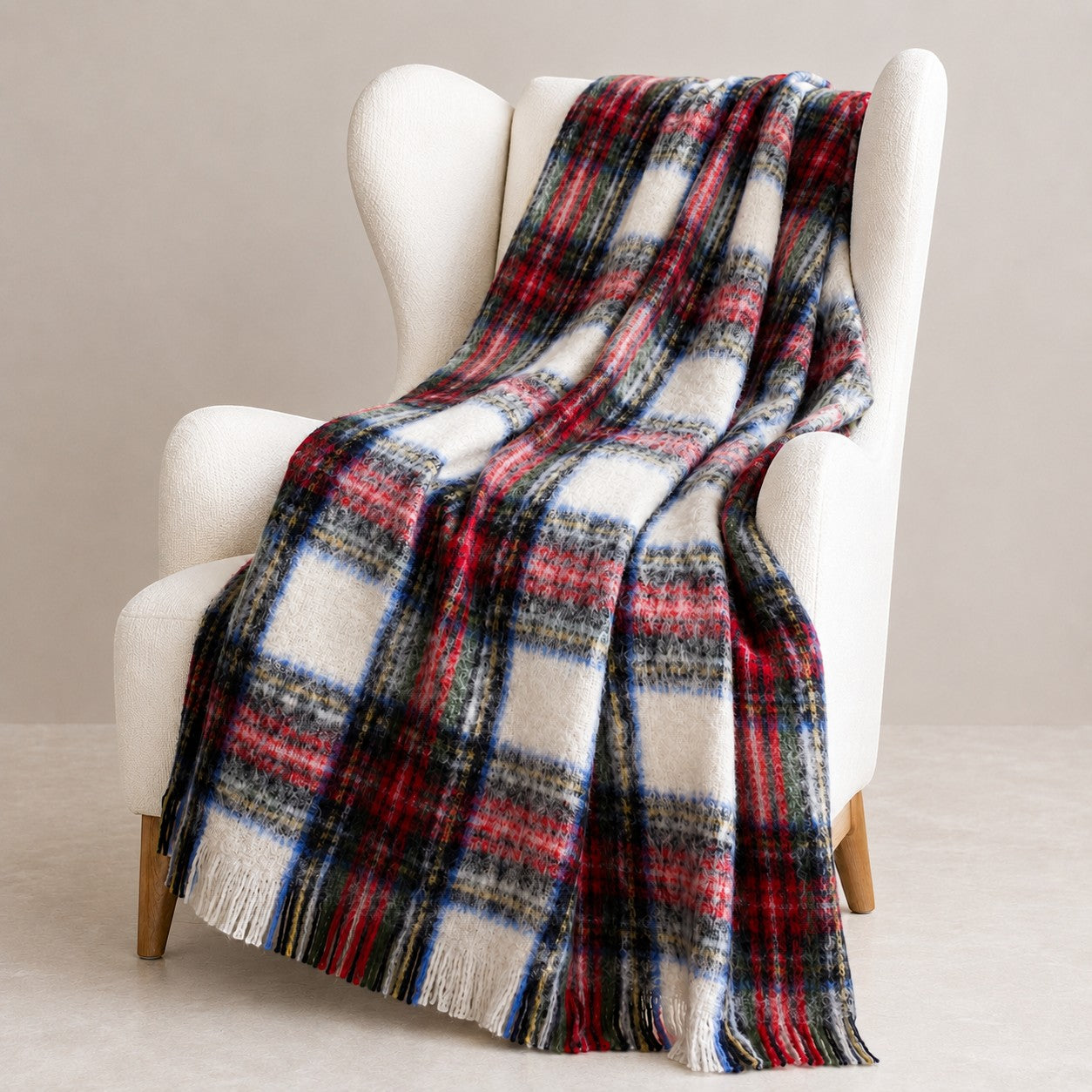 Luxury brushed alpaca throw in Dressed Stewart styled in over chair, warm natural fibre blanket.