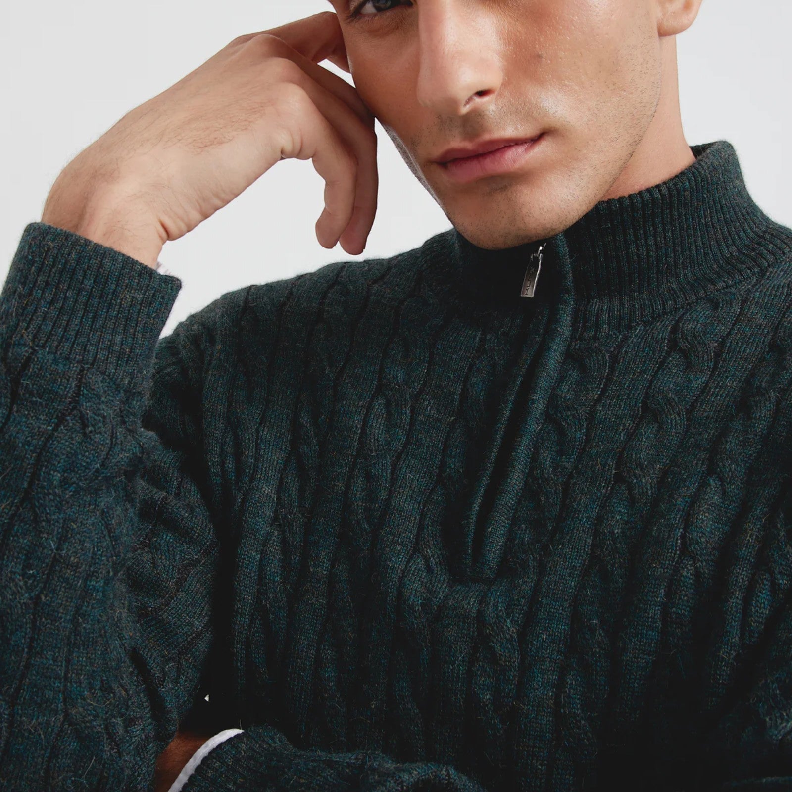 Close-up of Men’s luxury green alpaca half zip sweater for winter