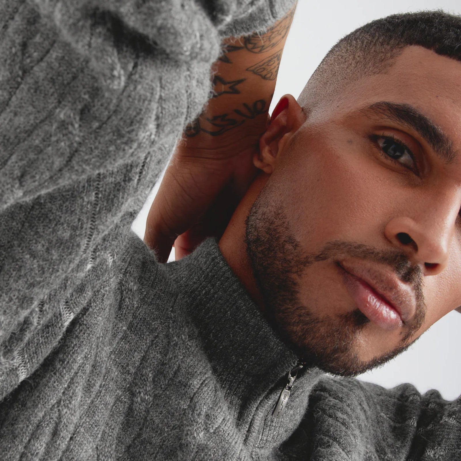 Close-up of Calypso luxury Baby Alpaca knit sweater in classic grey